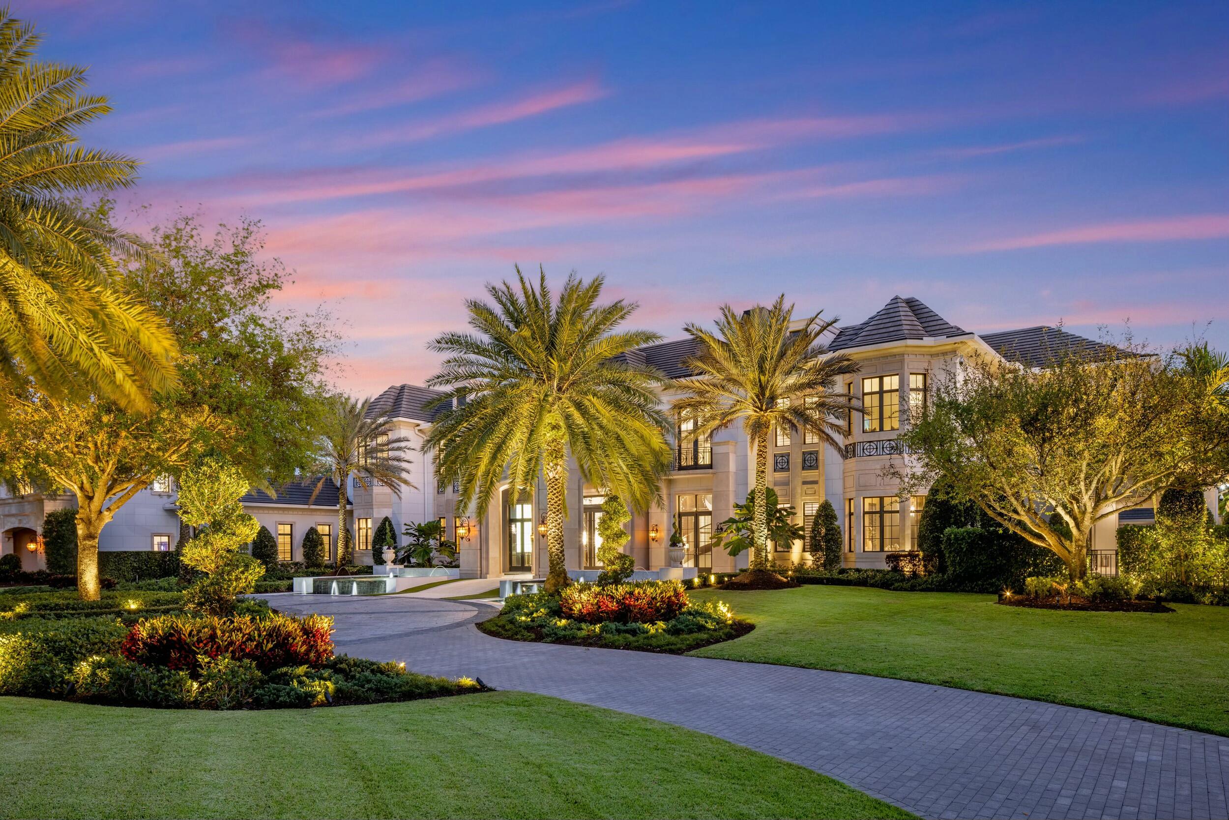 Welcome to Palazzo di Lago, an architectural masterpiece and a rarefied offering that embodies the pinnacle of luxury living in South Florida. This Italian contemporary estate is one of the most distinguished and impeccably executed residential compounds in the United States. Inspired by the tranquil glamour of Lake Como and infused with the seductive allure of Bond's Casino Royale, this Italian contemporary masterpiece is an ode to elegance, privacy, and security.

Nestled behind the gates of Stone Creek Ranch in Delray Beach—South Florida's coveted ''Billionaire's Row''—Palazzo di Lago  embodies the perfect fusion of European elegance and Palm Beach sophistication. Designed, reimagined and executed by the acclaimed Aldo Stark of Prestige Design Homes, the trophy estate comes fully furnished and curated to perfection. Every space has been meticulously considered to reflect a harmonious balance of bold sophistication and timeless refinement, resulting in a lakefront sanctuary that is as visually breathtaking as it is functionally flawless. 

Surrounded by lush, manicured grounds and secured behind its private gates, Palazzo di Lago offers a true sense of privacy and serenity, while remaining just minutes from the finest amenities South Florida has to offer. Set on an expansive 2.5 acre lakefront lot at 9200 Rockybrook Way in Delray Beach, this masterpiece spans an extraordinary 29,411 total square feet, including 17,797 square feet of interior living space. 

Upon arrival, the bespoke residence unveils a sweeping two-story foyer, bathed in luminous natural light that gracefully guides the eye toward the grand salon beyond. Here, soaring 30-foot ceilings and expansive walls of glass beautifully blends the lines between refined interior living and the tranquil allure of the lake. This breathtaking centerpiece is crowned by exquisite crystal chandeliers, custom-designed to dazzle, their delicate shimmer casting an ethereal glow that captivates at every glance.

Every detail of the home was brilliantly conceived for luxurious comfort, timeless beauty, and effortless entertaining. The Club Room provides an elevated space for gatherings both lavish and intimate, while the custom-designed home theater delivers a cinematic experience that rivals the best private screening rooms in the world. For the automotive connoisseur, the car gallery showcases prized vehicles in a setting that is both secure and stylish.

Palazzo di Lago is a retreat designed not just for living, but for escaping. The wellness wing includes a fully equipped gym, sauna, and massage room, and effortlessly opens out to a private tennis court and a saltwater lagoon pool that holds 170,000 gallons of cascading, crystal-clear water. At the heart of the residence is a chef's kitchen unlike any other, wrapped in rare walnut, accented with Italian gray marble, and built to inspire culinary brilliance. A secondary catering kitchen is discreetly tucked away for seamless service, and the breakfast room stuns with a glowing Oyster white agate feature wall that turns morning rituals into unforgettable moments.

The interiors reflect a refined European soul with a Floridian spirit. Hallways clad in high-gloss Brazilian Guyana wood create a rich, tactile flow throughout the residence. Italian stone, custom European finishes, and a moody color palette of mocha, burnt sienna, and soft beige provide warmth and depth; an atmosphere reminiscent of a secluded palazzo perched above a sun-kissed lake.

The primary suite is a world unto itself. From the mother-of-pearl inlay floors to the his-and-hers spa-inspired bathrooms, every inch is infused with opulence. A boutique-style dressing room with double-height shelving transforms daily routines into moments of indulgence, while private terraces and a hidden safe room offer security, beauty, and solitude. The remaining bedroom suites, ten full bathrooms, and two elegant powder rooms are equally appointed for luxurious comfort.

Outside, the elegant estate transforms into a dreamlike resort by night. The pool and spa are framed by lush landscaping and illuminated by custom lighting that casts soft glows across the vast property. A fully outfitted cabana with a private bath, kitchen, and bar invites evenings under the stars, where wood-fired dinners and champagne toasts are bountiful. 

Completing this exquisite offering is a hidden cigar lounge with advanced air purification, 2 private executive offices, and a fully equipped guest house offering seclusion and comfort for visiting family or staff.

Palazzo di Lago is not merely a home - it is a destination. A celebration of world-class design, cinematic romance, and elevated living, it is where European glamour meets Florida's radiant splendor in a seamless, sophisticated expression of legacy, luxury, and lifestyle.