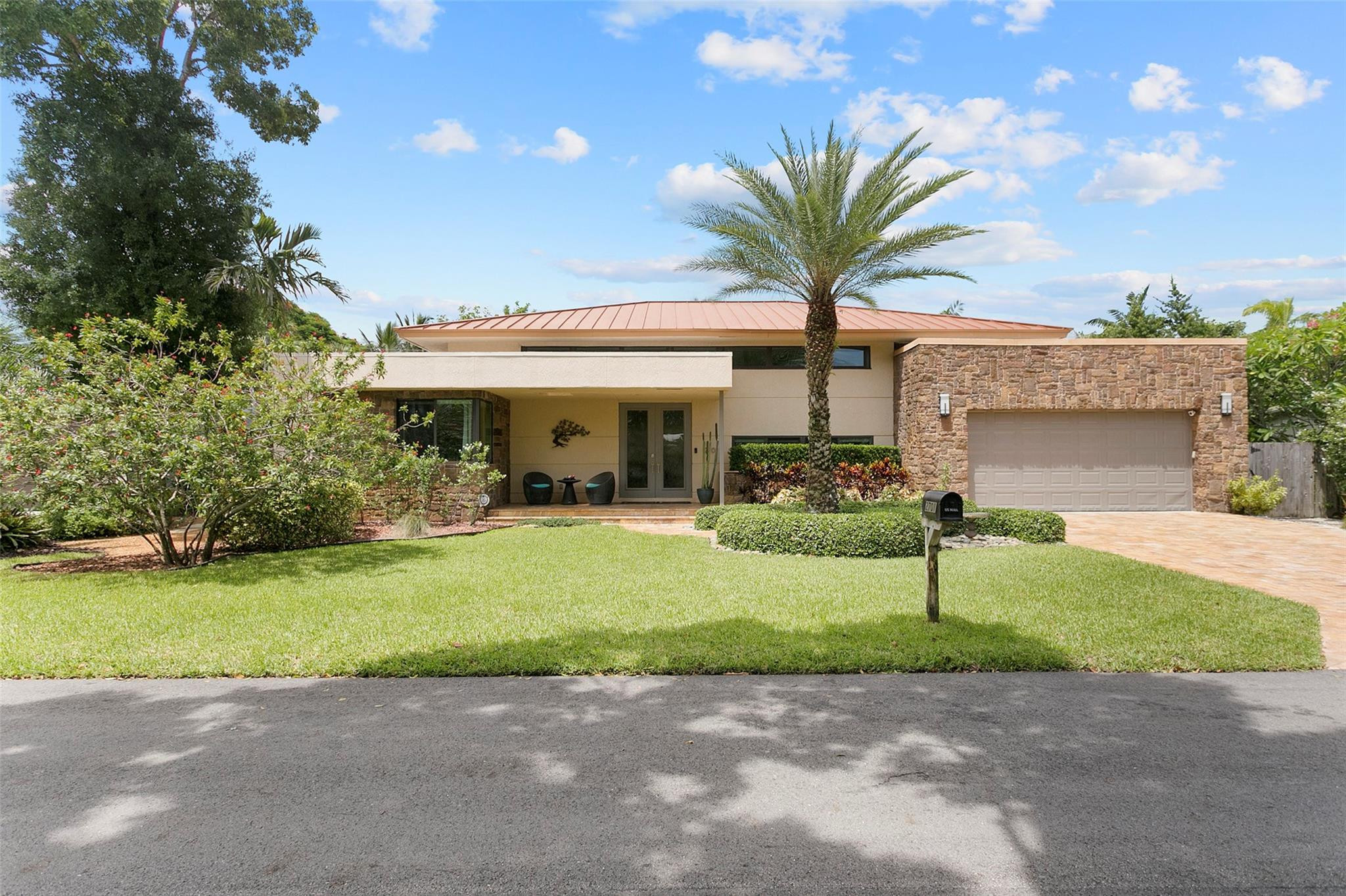 Your new architect-designed home has it all:  Just a 10-minute stroll to Wilton Drive with brilliant landscaping and curb appeal, a 1000 ft2 great room, 13' ceilings, 1.5 year old HVAC/appliances, whole-house generator, solar heated saltwater pool, impact windows/doors, metal roof, foam insulation, custom closets, surround sound, screened-in patio, well-water irrigation, pantry and more! Ideal for entertaining, don't miss this chance to move in to your dream home in your dream neighborhood and start enjoying the lifestyle of your dreams! Compare the low carrying costs: 2025 wind and property insurance $3,763 per year; December electricity: $196.70! Super energy efficient: didn't need heat during the 35 degree cold spell! Recent roof inspection. OFFERED AT BELOW APPRAISED VALUE!