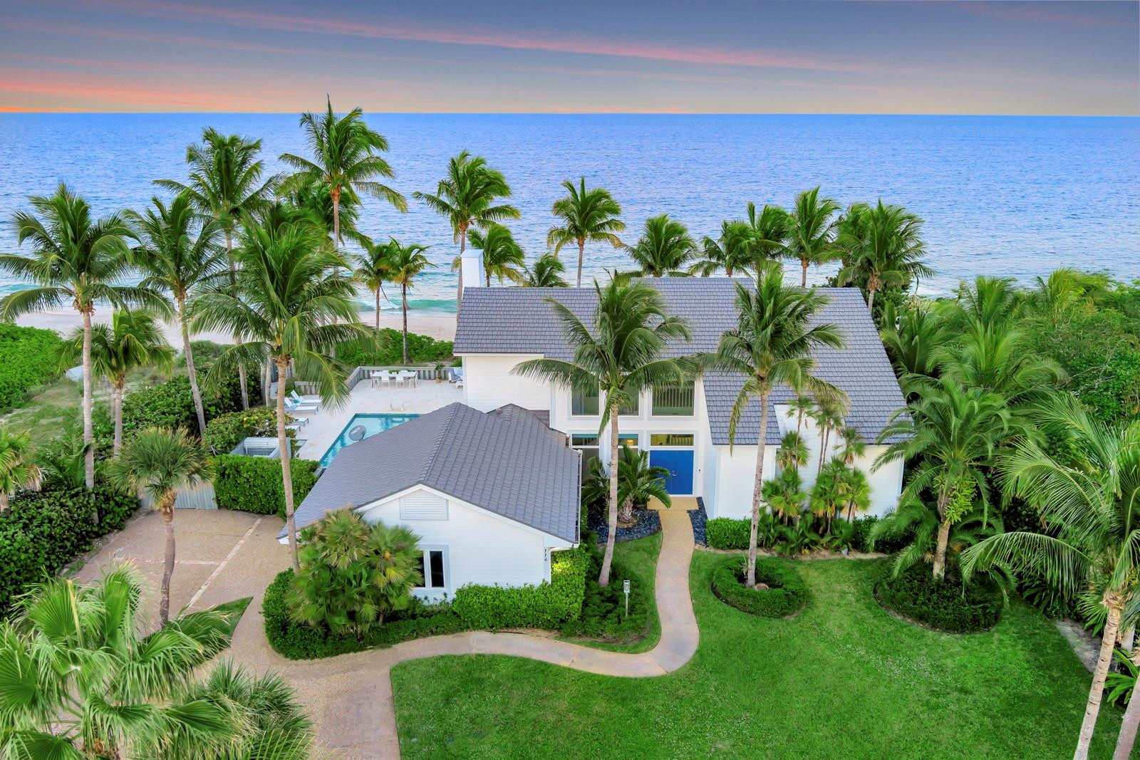 Turnkey oceanfront estate in the prestigious guard-gated community of Seagrove. Renovated by Croom Construction in 2012 with lifetime raised aluminum roof, impact glass, and electric storm shutters. Featuring 120 ft of private beachfront, floor-to-ceiling windows, and an open concept layout ideal for entertaining. Two elegant primary suites and sunlit living spaces create a seamless indoor-outdoor flow. Minutes from Vero’s upscale dining, boutique shopping, and cultural venues. A rare opportunity to own a refined coastal retreat in one of Vero Beach’s most sought-after enclaves. Move-in ready and meticulously maintained, with lush tropical landscaping, generous outdoor living spaces, and timeless architectural charm.