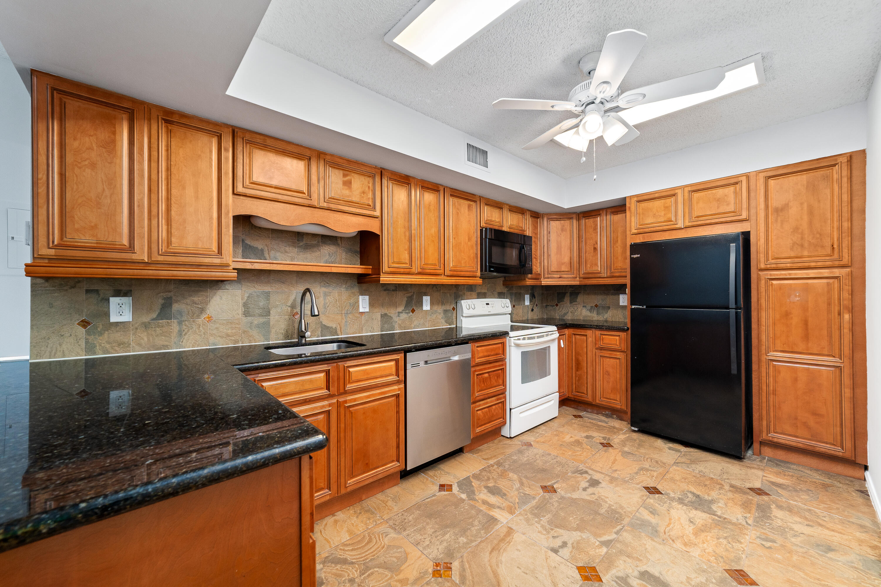 Welcome to this 3 bed/ 2 bath condo nestled in the Lake Windwood community. This residence offers 1,178 sf of finished living space, providing comfortable proportions for modern living. As a waterfront (ish) property, this condo is located in a guard gated community in Boca Raton. The thoughtful layout maximizes functionality and flow throughout the residence. This condo in Lake Windwood represents an outstanding choice for those seeking a distinctive property in a desirable Florida location. With indoor washer and dryer and new waterproof wood grain flooring this renovated home is a no brainer. The community has many walking paths around the lake, 2 pools and a dog park! Hurry this won't last...