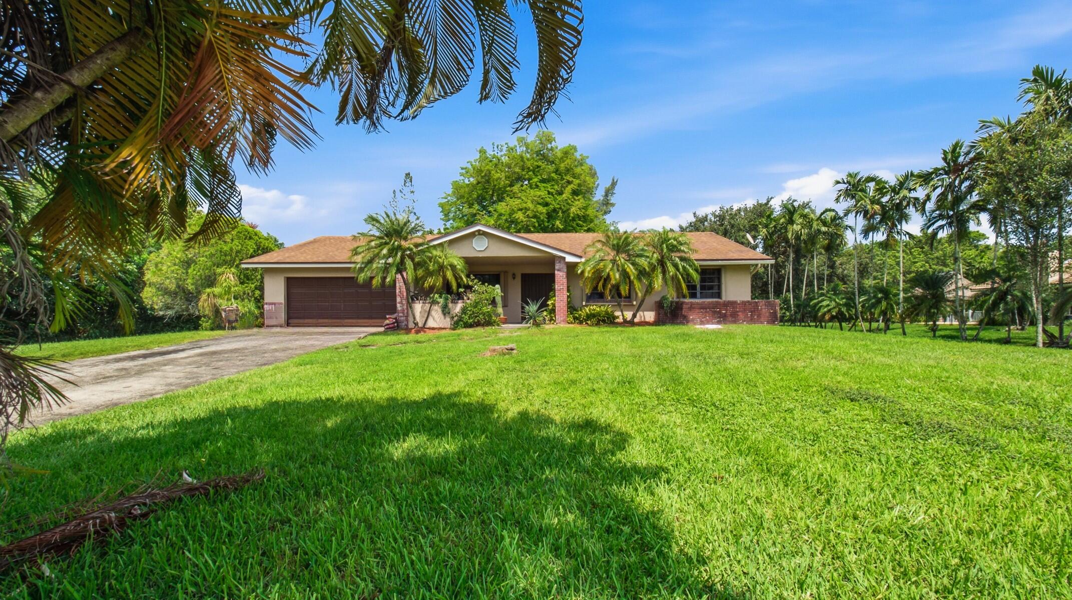 Welcome to the peaceful neighborhood of D & M Acres. The property is surrounded by woods on two sides and wonderful neighbors next door and across the street. While in a quiet country setting with a cattle pasture close by , this ideal Location has easy an 5 minute access to I-75, I-595 and the Sawgrass Expressway. World renowned Healthcare is a mere 3 mininutes away at the Cleveland Clinic Hospital and Medical Center. Only 22 minutes east is Fort Lauderdale International Airport. 8 minutes further is Downtown Fort Lauderdale, Las Olas and the famous Fort Lauderdale Beach. Shopping abounds in the area with the Huge Sawgrass Mills Outlet Mall. Directly adjacent to D & M Acres are the very prestigious areas of Weston and Southwest Ranches. There are many parks in the area including Markam Park for the outdoorsman. Everglades Holiday Park with Airboat rides thru the Everglades. Vista View Family Recreational Park and only 20 minutes west is the Everglades Elevated Boardwalk with panoramic views of the Everglades. The home itself sits on just under an acre at the quiet end of the last Cul De Sac. It provides the most unique opportunity to turn this sanctuary in to a private paradise by acquiring the half acre to the north increasing the property by 50% before someone else buys it. Thus ensuring NO further development and greatly increasing the value of the property well beyond its cost. At over 2,276 SF, the home itself boasts a large Master Bedroom with walk in closet and ensuite bathroom. Generous sized bedrooms, with the guest room attached to the half bath and direct access to the back Patio. There is also a large great room and 3 sets of French doors leading to the back covered Patio. The homes' need for interior remodeling provides the new owners a clear path to redesign to their exacting tastes. The exterior has been equipped with 'Easy Close' Hurricane proof accordian shutters. The roof has top of line architectural shingles installed only 4 years ago. The home has 2 AC units, the most recent replaced only 2 years ago. The Septic tank was cleaned in June. The Well system has been completely refurbished including brand new pressure tank also in June. Homes with this much value and land don't become available often, schedule your showing today!