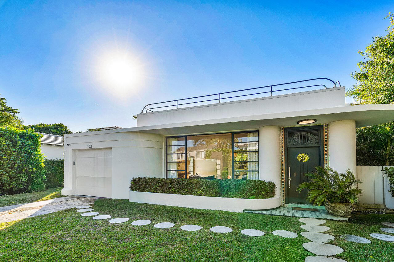 Nestled in Palm Beach's most coveted in-town location, just steps from Worth Avenue and the beach, this one-of-a-kind residence blends timeless charm with modern comfort. The light-filled 3 bedroom, 2 bathroom home is designed for effortless entertaining, featuring a poolside bar and an expansive rooftop terrace with lush landscaping, a private putting green, and city views.