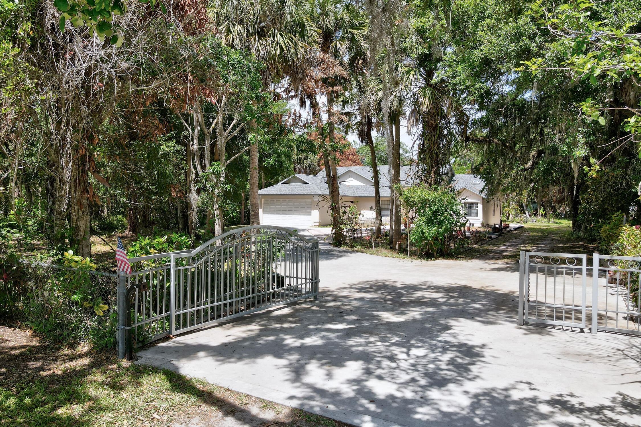Beautiful Property and Home with large rooms, tile floors except one bedroom, carpet, No HOA, new hot water tank, electric, 2 yr old roof, air conditioner 2 yrs old, includes Ref., Stove, Microwave, Washer, Dryer. Fenced property with gated entrance. 1/2 half of pond, Chair rails of Black Walnut and Oak. Kitchen Cabinets, Oak, 2 Skylights, one kitchen, one in the master bath, Cathedral Ceilings. Porch is enclosed with windows.