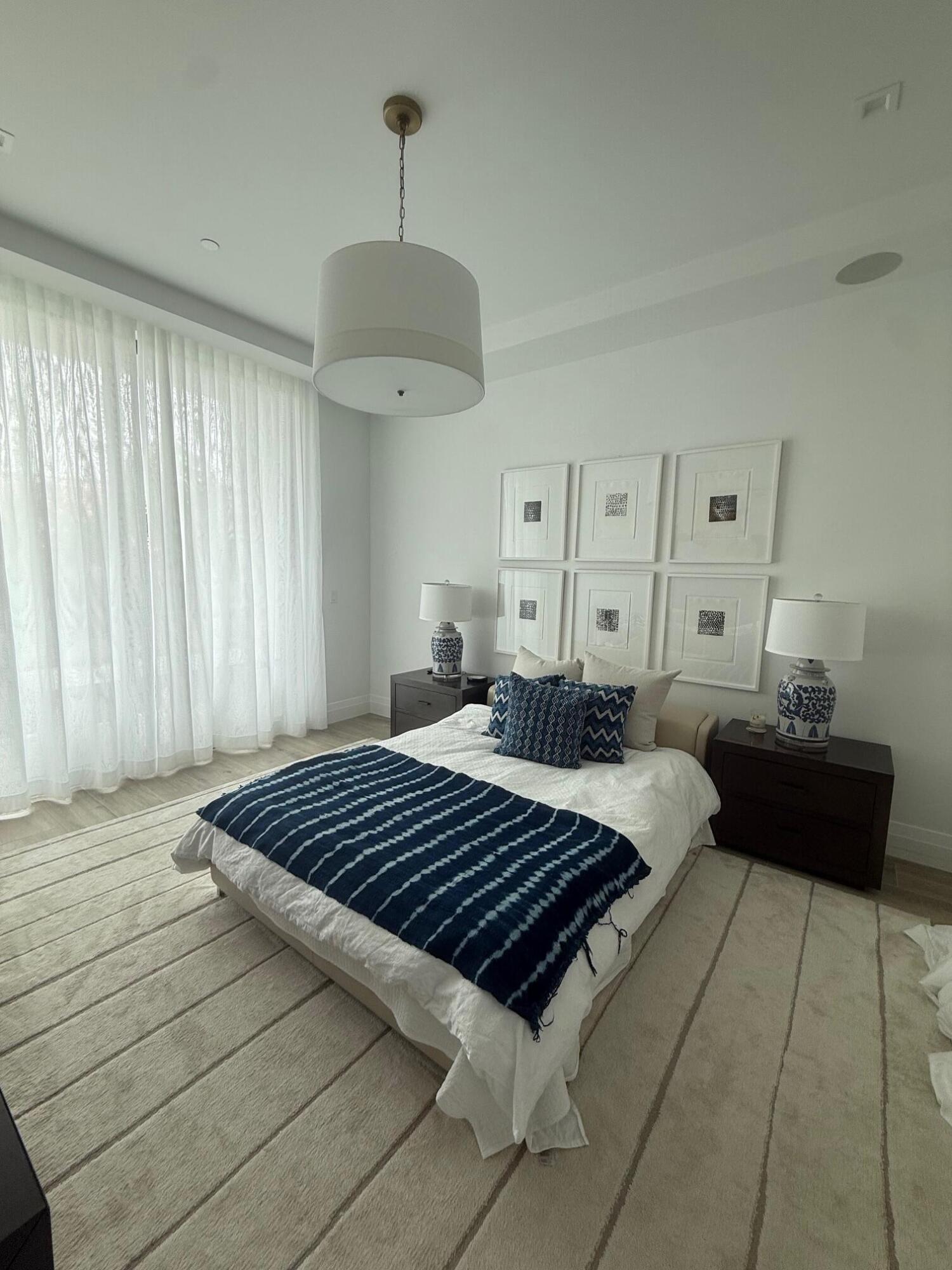 Live on the East side of the bridge in walking distance to the beach and Delray's Atlantic Avenue. Upgraded 3 bedroom, 3.1 bath residence in the newest and best condo building, 1177 Moderne. Elevator opens directly into your private unit filled with light through the floor to ceiling windows and doors. Gallery hallway provides access to all rooms. Gourmet kitchen boasts top of the line appliances and custom fixtures. Beach wood inspired porcelain tile and custom draperies and private balcony are additional features. Each of the three bedroom is ensuite and includes additional closet space. Separate laundry and storage room in unit. Additional storage with every unit in the building. Beautiful cabana deeded to the unit. Pool, gym, steam, sauna and hot tub amenities that  enhance the living experience. Two garage parking spaces with EV charging set ups available.