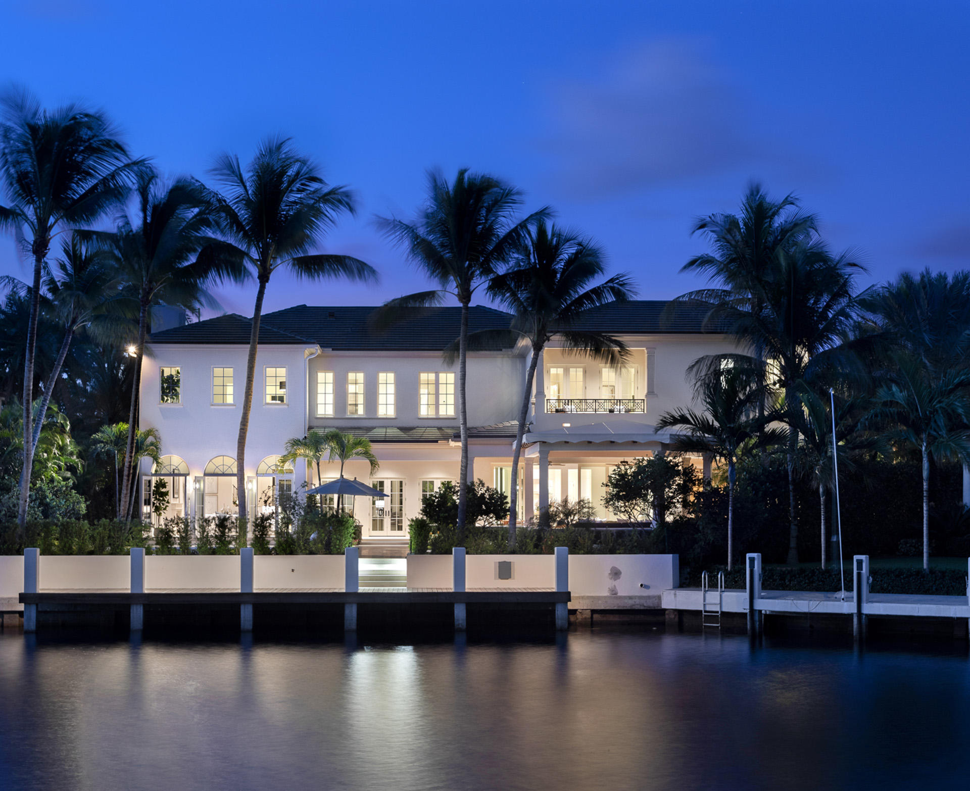 An expansive paver motor court, leading to a 5-bay collector's garage, is framed by a manicured landscape of specimen palms and tropical shrubs with pristine expanses of Bermuda grass. A magical side garden is equally ideal for quiet reflection or entertaining, as is the sublime rear loggia with full barbecue summer kitchen and adjoining pergola for poolside alfresco dining. With a 35'x17' heated waterfront pool and separate cabana bath, private 70' dock for a 60' boat and direct ocean access, this property ensures idyllic Florida living.  Move in ready with select furniture available. DISCLAIMER: Information published or otherwise provided by the listing company and its representatives including but not limited to prices, measurements, square footages, lot sizes, calculations and statistics are deemed reliable but are not guaranteed and are subject to errors, omissions or changes without notice. All such information should be independently verified by any prospective purchaser or seller. Parties should perform their own due diligence to verify such information prior to a sale or listing. Listing company expressly disclaims any warranty or representation regarding such information. Prices published are either list price, sold price, and/or last asking price. The listing company participates in the Multiple Listing Service and IDX. The properties published as listed and sold are not necessarily exclusive to listing company and may be listed or have sold with other members of the Multiple Listing Service. Transactions where listing company represented both buyers and sellers are calculated as two sales. The listing company's marketplace is all of the following: Vero Beach, Town of Orchid, Indian River Shores, Town of Palm Beach, West Palm Beach, Manalapan Beach, Point Manalapan, Hypoluxo Island, Ocean Ridge, Gulf Stream, Delray Beach, Highland Beach, Boca Raton, East Deerfield Beach, Hillsboro Beach, Hillsboro Shores, East Pompano Beach, Lighthouse Point, Sea Ranch Lakes and Fort Lauderdale. Cooperating brokers are advised that in the event of a Buyer default, no commission will be paid to a cooperating Broker on the Deposits retained by the Seller. No commissions are paid to any cooperating broker until title passes or upon actual commencement of a lease. Some affiliations may not be applicable to certain geographic areas. If your property is currently listed with another broker, please disregard any solicitation for services. Copyright 2020 listing company All Rights Reserved.