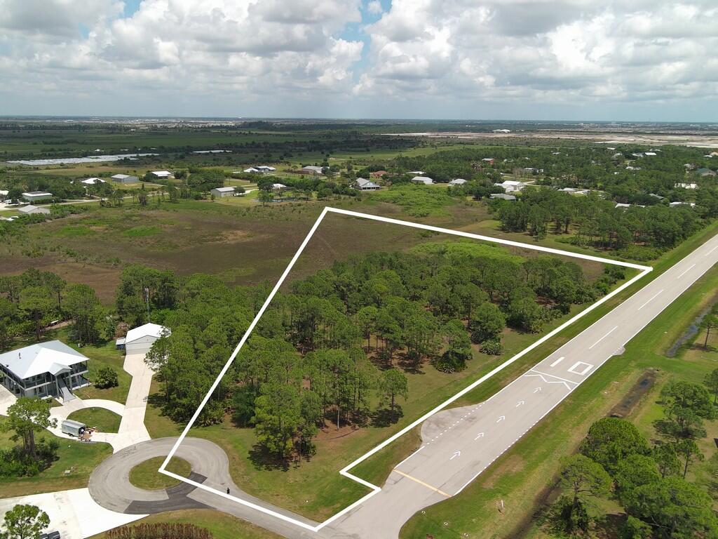 Treasure Coast Airpark" (FL37) in Port Saint Lucie, FL, BUILD HANGAR WITHOUT HOME IS ALLOWED Zoned AG-5 Just to the West of Tradition. This is a Unique Opportunity to own the Last Vacant piece of Vacant land 6.3 acres with 547' on the Runway and direct access to a 4,067' x 48' lighted asphalt airstrip. Owners Plans changed - You can use his plans or build your own larger hanger. See Lot and Size Dimensions for Building up to 10% of Lot as per Town Approx 27,000. sf. End of runway advantages.