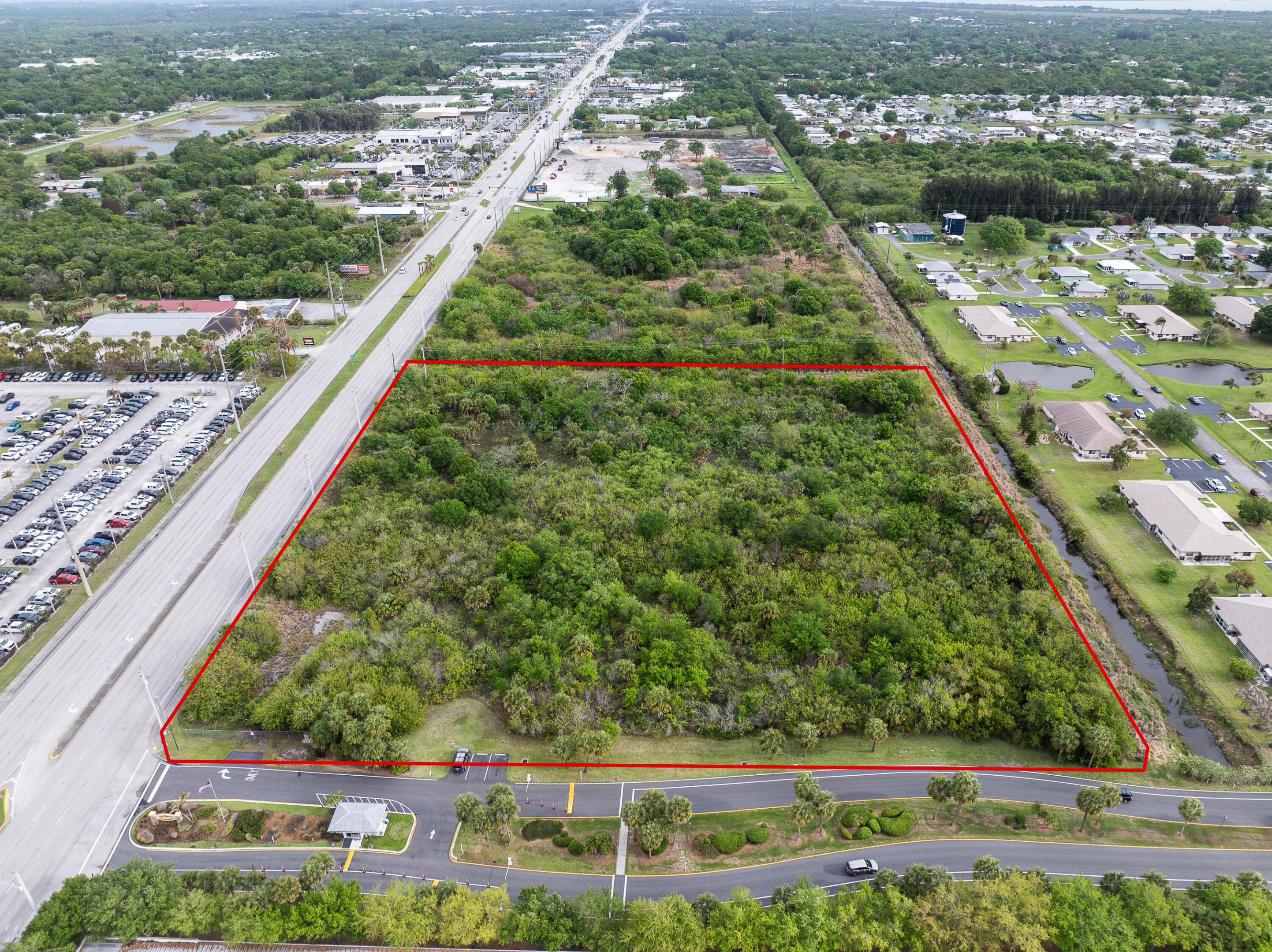 Prime US #1 commercial development site with 510 feet of road frontage.  Rapidly growing location between South Fort Pierce and Port St Lucie.  Located across from Arrigo Chrysler, Dodge, Jeep.  Near numerous other dealerships including new  Bev Smith Kia under construction.  Solid residential roof top count with 7,000 with in 2 miles radius and 48,500 roof tops in 5 mile radius.  Over 300,000 population in 10 mile radius of this site.  30,000 average daily traffic count in front of this property.  See documents section for more details.  See photos for water/sewer map.  FPUA water, sewer, & gas available to site.  FPL electric available to site.