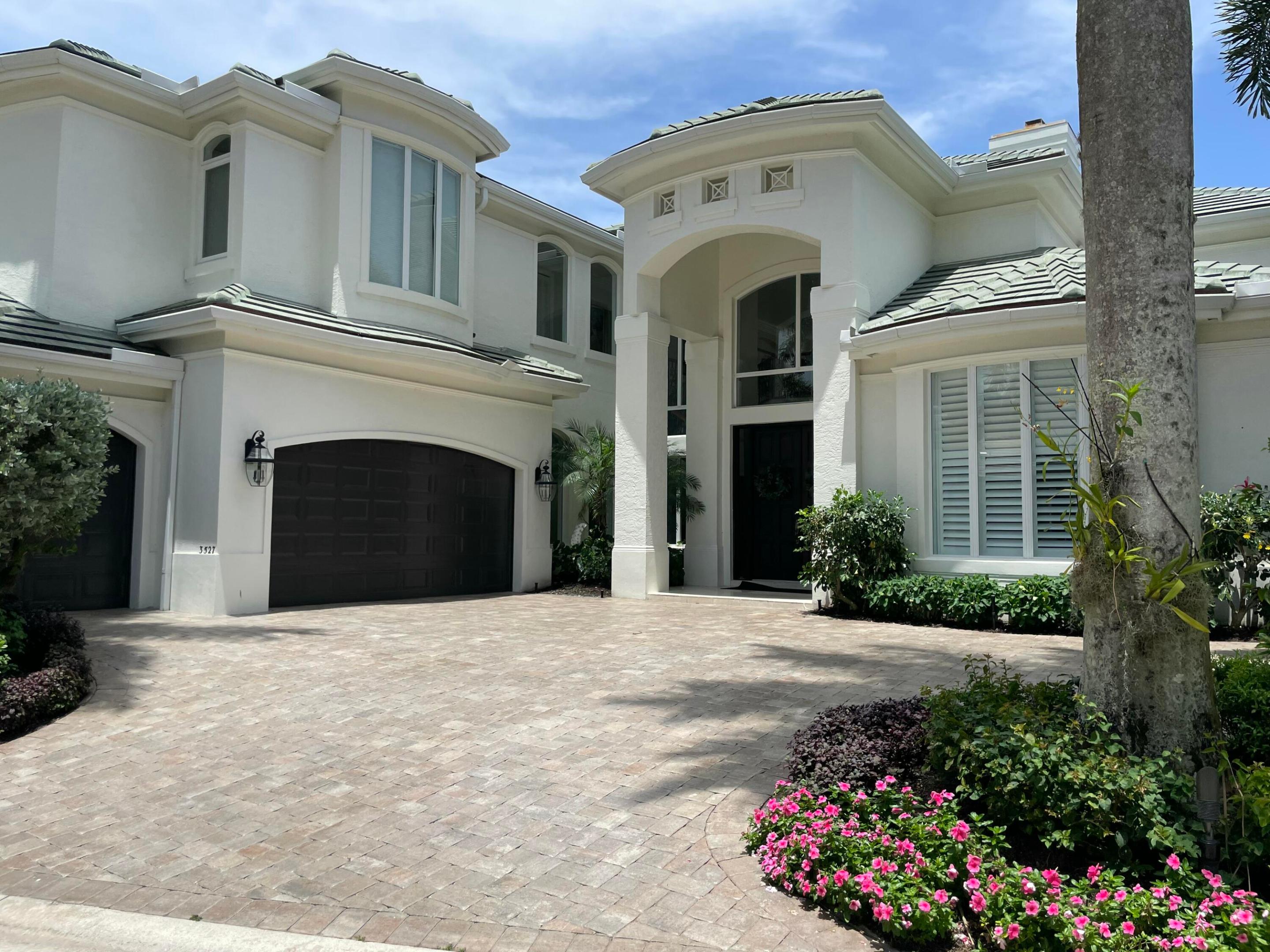 Exceptional waterfront estate nestled within the exclusive Jonathan's Harbour enclave of Jonathan's Landing, an intimate gated community renowned for its privacy and prestige. Showcasing breathtaking deep-water views, this spectacular residence offers 6,104 square feet of refined living space with five bedrooms, six full baths, and two half baths.  Designed for both luxurious living and effortless entertaining, the resort-inspired outdoor setting features a stunning waterfront pool, expansive patio areas, a summer kitchen, and a full cabana bath, all overlooking the tranquil deep-water lagoon. Boating enthusiasts will appreciate the deeded dock slip accommodating up to a 50-foot vessel, with quick access to the Intracoastal Waterway and no fixed bridges for ocean access.  The thoughtfully designed floor plan features a first-floor primary suite, providing both comfort and privacy, while an additional upper-level suite offers the flexibility of a second primary retreat. This remarkable estate embodies the finest in waterfront living within one of Jupiter's most sought-after communities.