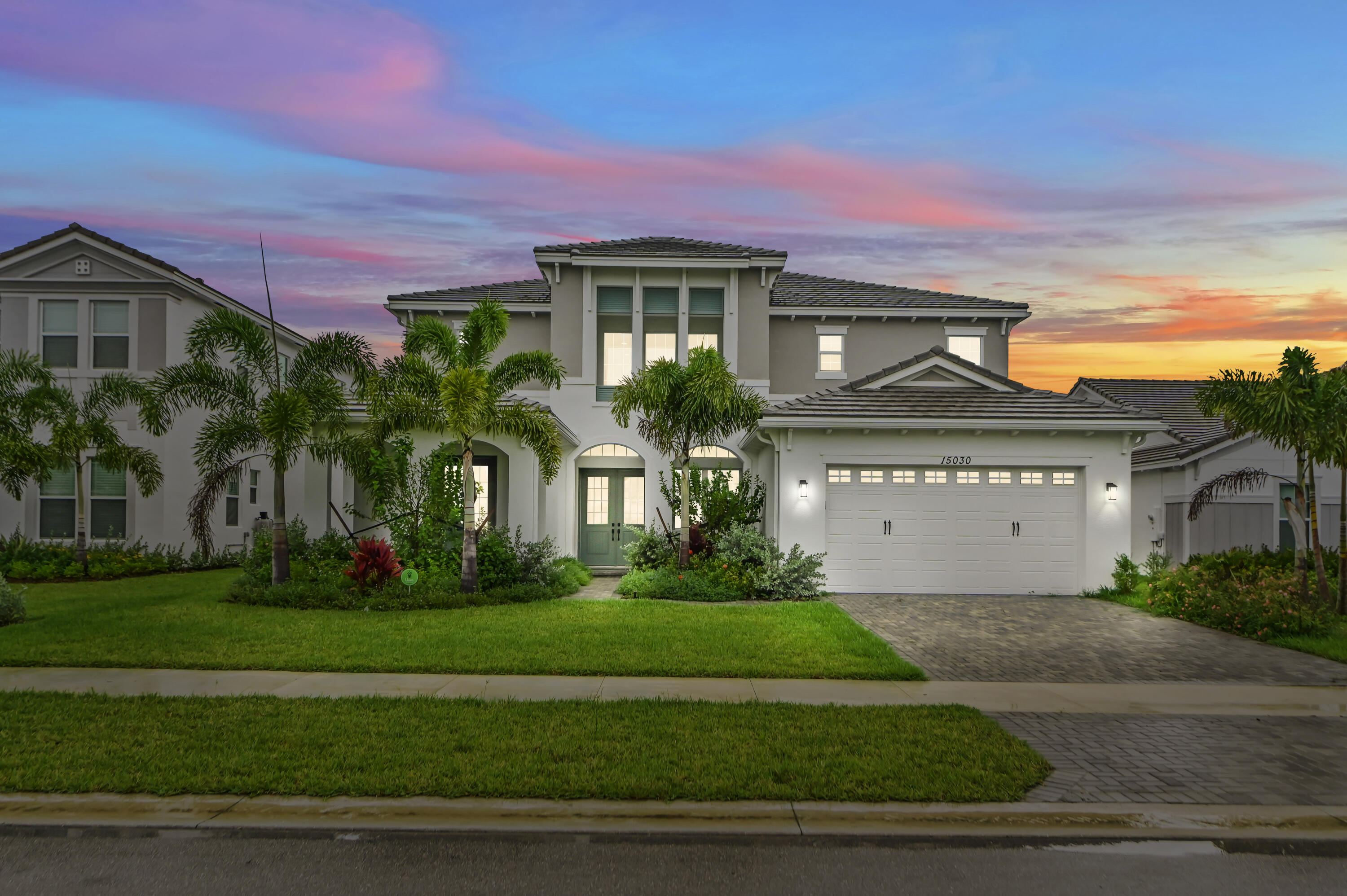 Tucked away on a peaceful cul-de-sac in the heart of Westlake, 15030 Wildwood Circle offers the perfect blend of space, comfort, and Florida charm. Set on an expansive waterfront lot surrounded by lush greenery, this beautifully maintained home welcomes you with soaring ceilings, abundant natural light, and an open layout designed for both everyday living and effortless entertaining. From the moment you arrive, the property's privacy and tranquil setting create a true retreat from the hustle and bustle. Inside, the home showcases spacious living areas, a thoughtfully designed kitchen, upgraded flooring on first & second floors and generously sized bedrooms that provide comfort for the entire family. Large windows and sliding glass doors frame picturesque outdoor views while seamlessly connecting indoor and outdoor living spaces. The primary suite offers a relaxing escape with ample space and spa-like touches, while the additional rooms provide flexibility for guests, a home office, or growing families.  Step outside and experience your own private oasis. The oversized backyard offers endless possibilities — whether you envision a pool, outdoor kitchen, gardens, or space for recreational vehicles and toys. With room to roam and no shortage of fresh air and sunshine, this property captures the laid-back lifestyle.