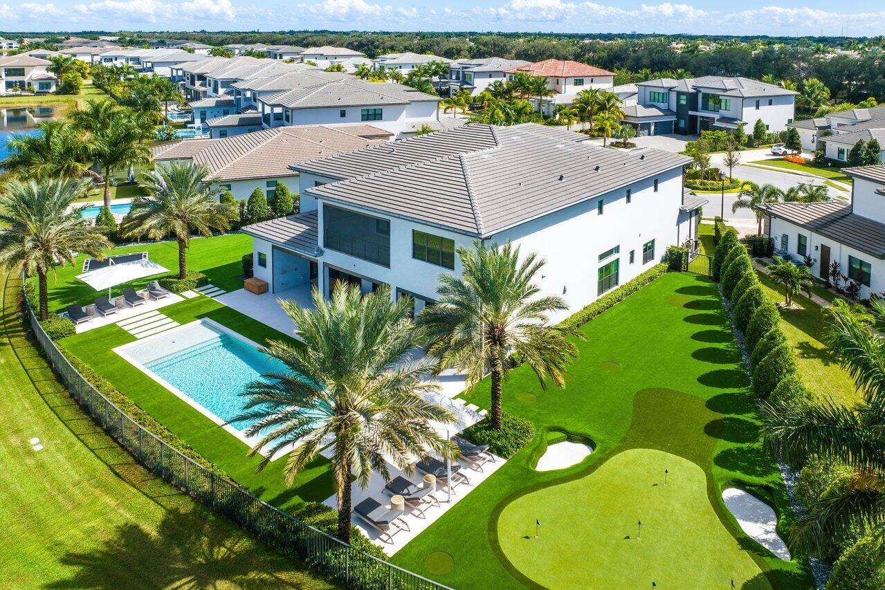 Live the ultimate FL lifestyle with this turn-key, custom SMART home, set in a private cul-de-sac, with almost 1/2 an acre of lake views. This contemporary, open floor-plan Riverside model, with 5 VIP suites & 6.5 baths, can only be found in Boca Bridges. Meticulously designed by IG Workshop, this entire residence flows from inside to outside, with no detail overlooked. Highlights include: 10'' engineered wood plank flooring, custom millwork, dream kitchen with Calcutta marble protected by Tuff skin 2x sinks, 2x dishwashers, 3 ovens & Subzero/Wolf appliances. Turfed yard with custom pool/spa, 40 yard par-3 putting with English-style pot bunkers, in-ground trampoline, landscaping, lighting and surround sound. Lot has room to build a 1-story pool/guest house. See supp for full upgrade list. Boca Bridges is an upscale, gated community that promises an unparalleled living experience. The centerpiece of this luxurious enclave is the magnificent 27,000 square-foot clubhouse, providing residents with access to a resort-style pool and a full-service gourmet restaurant and bar.

For those seeking an active lifestyle, there is a state-of-the-art fitness center, offering a range of exercise classes. The community has tennis courts, pickle-ball courts, both indoor and outdoor basketball facilities, and a card room.

Families can enjoy a kid's splash park, an outdoor pavilion for parties, a game room, and many kids' activities throughout the year.

It's all in the details.

AV Work:
Fully automated smart home. Everything is controlled via one app, TV remotes or touchscreen on the wall
Whole Home Lutron Lighting Control System
10 Keypads strategy placed throughout the home
All other switches are dimmable
Savant Home Automation System
Ceiling speakers throughout the home for music and surround sound
Coastal Source audio speakers on the exterior of the home
Entire property has landscape lighting
Waterproof Samsung TV/Soundbar outside on the pool deck.
Sony OLED TV's throughout the home with custom Savant Soundbars to match TV size.
Full HD Surveillance system inside and outside the home.
Enterprise Grade Network and WiFi.
Master bedroom equipped with Lutron Automated Shades and
Lutron receptacles that are all child proof.
Additional noteworthy custom features:

This dream home includes high-end lighting, ensuring an exquisite aesthetic throughout:
Luke Lamp Co 
KELLY WEARSTLER
Trueing 
Lee Broom 
Bone Simple

Additional amenities include oversized four-car garages, epoxy-coated floors.
AC in Both garages.
Water filter system/softener/disinfection system.
Custom sprinkler system controlled via an app to cool down the turf during the summer months.
Custom closet created under stairs in the garage for storage.
Generator
Extended driveway and side path
Upgraded AC system upstairs (infinity series)
2 Tuuci Grand Master 14' cantilever umbrellas by pool (inground mounts)
1 Tuuci umbrella for pool
Gas pool heater with auto fill and auto drain to keep waterline at perfect height. Custom 2" shelf in hot tub perimeter so arms are still in the water.
48" deck tiles (4 extra)
Electric screens for rear and upstairs patio to protect against bugs and sun.
Custom par 3 with English style bunkers
Upgraded marble tops in the kitchen, all bathrooms except bedroom downstairs, loft and clubroom bars. Custom marble dinning table/base all sealed with tough skin.
Full Gym
Entire backyard turfed.
Custom loft/bar/great room and clubroom millwork.
Marble wall in clubroom with bathroom countertop to match wall.
Kosher home: Two sinks, two dishwashers and two ovens.
Two custom subzero refrigerator/freezer in kitchen with cabinet ready panels to match cabinetry.
Wine fridge in loft and clubroom bar
Buster and punch hardware in kitchen
10" wood floors throughout the house and master ceiling.
Baby fence around pool if needed.

Wallpaper/Fabrics for Drapes:
Gucci 
Drop It Mod 
Schumacher
Casa Metier 

Custom Closets: 
California Closets in Guest Rooms and Primary ITALKRAFT 

Hardware:
Buster and Punch Hardware in the Kitchen and Powder Bath 
Dutton Brown in Kids Rooms