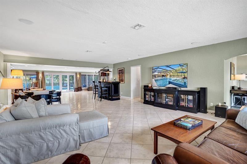 WHAT A BEAUTIFUL HOUSE LOCATED ON A DOUBLE LOT WITH ALMOST 2700 SF LOCATED LESS THAN A MILE FROM THE OCEAN. ONE STORY HOME WITH A LARGE CIRCULAR DRIVEWAY AND A VERY OPEN FLOOR PLAN. 3 BEDROOMS & 3 FULL BATHROOMS THAT HAVE BEEN UPDATED. LARGE 2 CAR GARAGE AND EXTRA DRIVEWAY IN THE BACK OF THE PROPERTY.  GREAT SPLIT FLOOR PLAN WITH 2 GUESTS BEDROOMS ON ONE SIDE OF THE HOUSE AND PRIMARY BEDROOM ON THE OTHER SIDE. HURRICANE IMPACT WINDOWS THROUGHOUT. A GORGEOUS LARGE SWIMMING POOL WITH A RAISED UP SPA AND LARGE DECK FOR ENTERTAINING. ENTIRE BACKYARD AREA IS SCREENED IN AND FENCED IN.