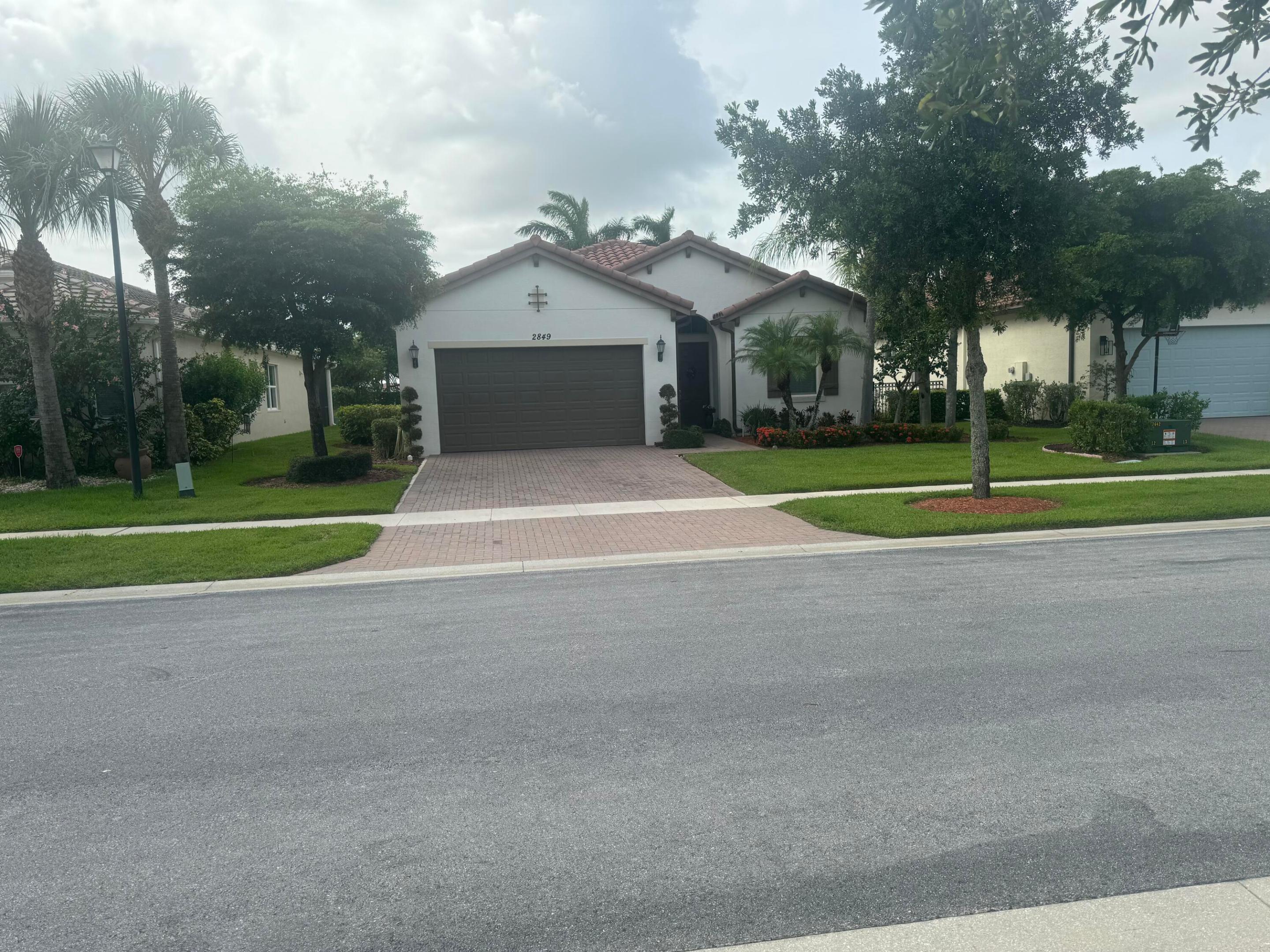 You will fall in love with this impeccable single story house in the fantastic community of Porto Sol! This fully upgraded 3 bed, 3 bath home was just recently built in 2013 and is full of luxurious and modern features. The kitchen includes new s/s  finger print resistant  Samsung smart hub fridge, whirlpool dishwasher, stove with built in air fryer and microwave. The living areas and bedrooms all feature Italian porcelain tile mimicking vintage faded hardwood floors. The 3rd bedroom has been upgraded to a suite with a full bath. A covered patio overlooks a quiet, private backyard with ample space to build a pool. This move in ready home is located on a quiet street in Porto Sol, one of the best gated communities in Royal Palm Beach with a clubhouse that features a resort style pool.
