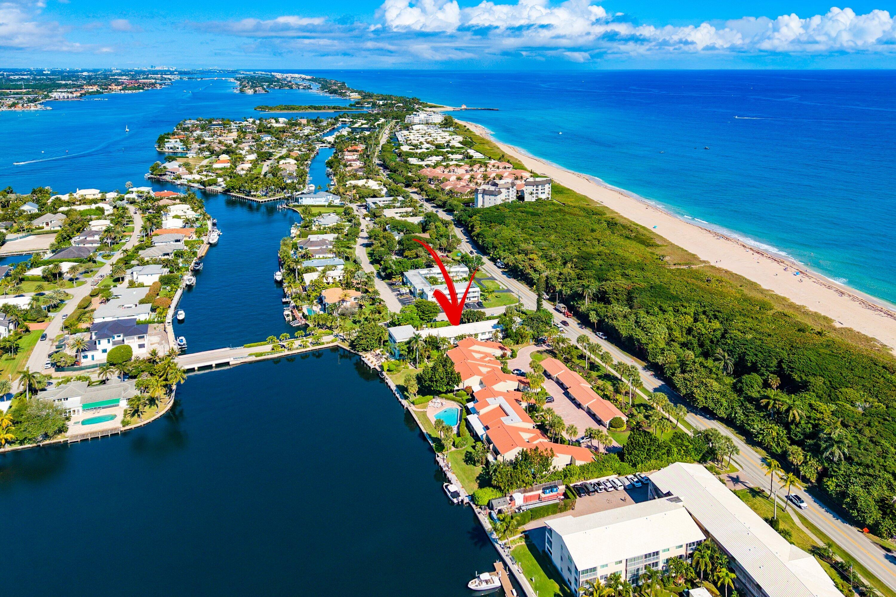 Tucked away in the Town of Ocean Ridge, Florida, one of South Florida's best-kept coastal secrets, this exceptional condominium offers a rare opportunity to experience beachside living the way it was meant to be. Ocean Ridge is a charming seaside town known for its peaceful atmosphere, its own dedicated police force, and a strong sense of community—often described as a true taste of Old Florida, where life moves at a calmer, more refined pace. Perfectly positioned between the Intracoastal Waterway and the Atlantic Ocean, this beautifully maintained residence is located in the intimate Ridge Homes Condominium, a boutique community of just 10 units. Designed for those seeking tranquility and privacy, the 55+ community offers a relaxed coastal lifestyle with lush  surroundings and a serene community pool. The condo is move-in ready and thoughtfully designed, featuring two bedrooms and two and a half bathrooms, tile flooring on the first level, and complete impact windows and doors for peace of mind. A private back patio provides a quiet outdoor retreat, while residents enjoy access to a day dock just steps away perfect for soaking in the Intracoastal views.  Best of all, the property offers the ultimate beachside convenience with direct beach access across the street, allowing you to go from your front door to the sand in moments.  Whether you're enjoying sunrise walks along the beach, afternoons by the pool, or quiet evenings in this tranquil coastal enclave, this Ocean Ridge condominium delivers an exceptional lifestyle in a town that truly feels like a hidden gem.