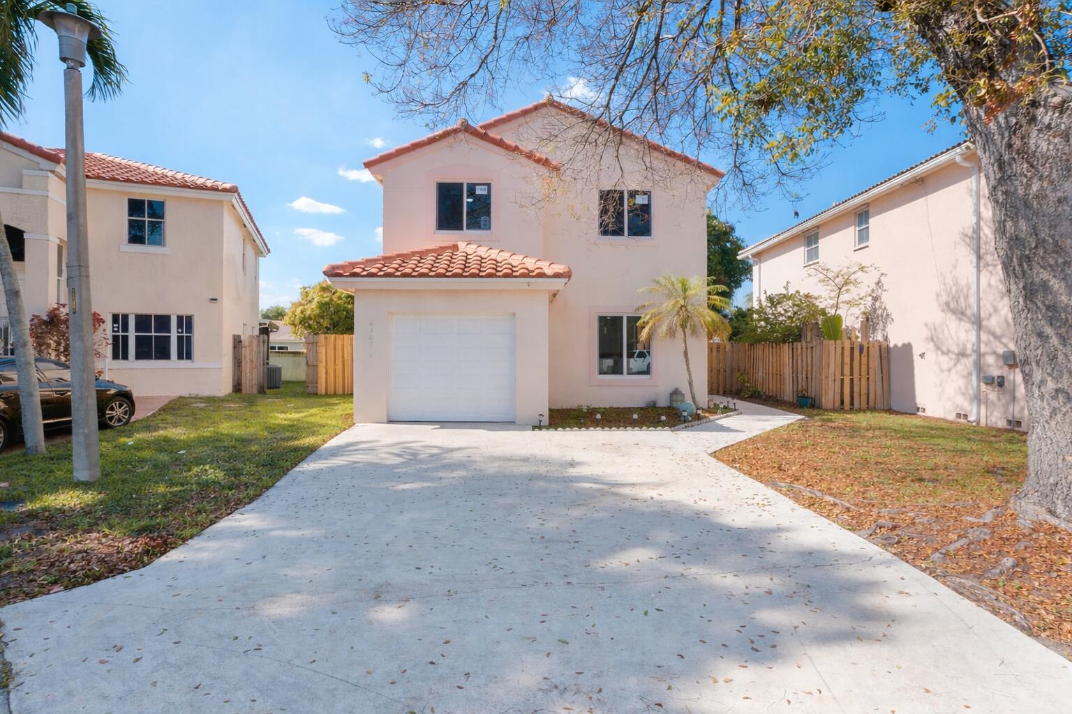 Welcome to this beautifully fully renovated home w/ private pool located in the highly desirable gated community of Coral Bay! features a brand-new roof, impact windows, and brand-new tile flooring throughout, offering both style and peace of mind. Step into the gorgeous new kitchen complete with stainless steel appliances, wood cabinetry, and elegant quartz countertops, perfect for cooking and entertaining. The home also boasts fully renovated bathrooms featuring new vanities, modern tile, quartz countertops, and brand-new tubs, creating a clean and contemporary feel throughout. Enjoy outdoor living with an extended patio ideal for entertaining, a brand-new fence for added privacy, and a brand-new open patio deck upstairs, perfect for relaxing or enjoying the Florida sunshine.