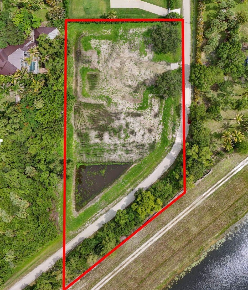 An opportunity to own a recently CLEARED AND FILLED OVERSIZED 2.3 ACRE Lot in the desirable Palm Beach County Estates.The property is in a very quiet, private area, adjacent to Riverbend Park and has no neighbors to the north .All inspections have been PASSED and ALL permits have been closed out.Conveniently, it has a small retention pond ,and is ready for you to build a Luxury Residence with ample space for your choice of another parcel(s). Exquisite House plans of a 4/5 Bedroom,4,000sft ,4-Car Garage with Pool are included with the purchase by Renowned Architect Randall Stofft;or customize and build your own dream Home .The Lot has city water available and conveniently a fire hydrant along its perimeter. Location is optimal,as it is only 2 miles from retail, restaurants, new hospital.