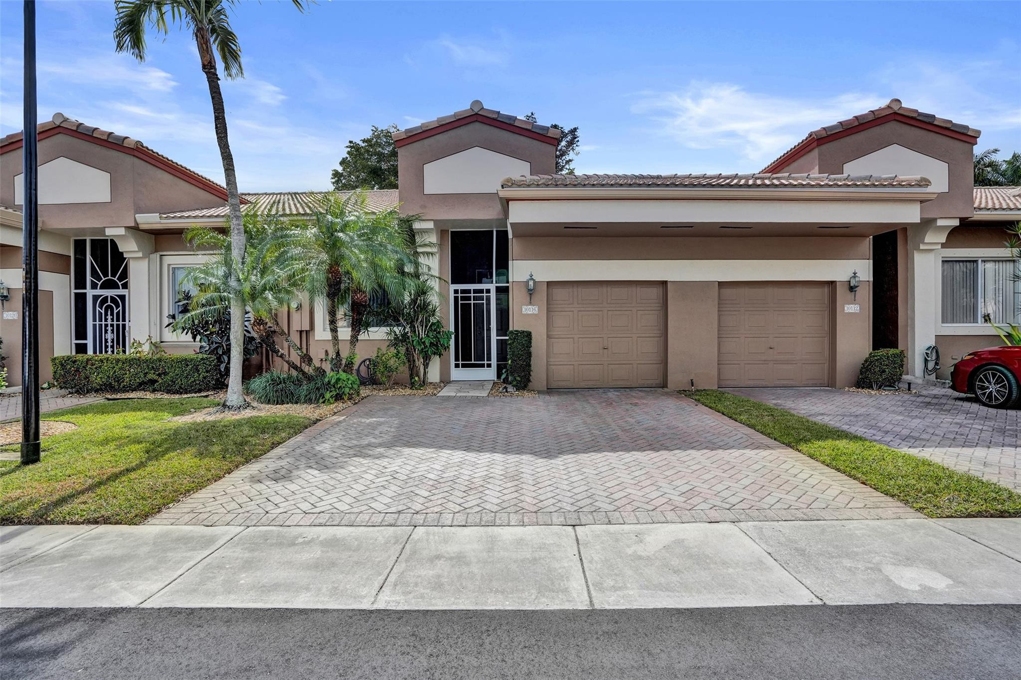 Elegant 2/2 villa in the gated neighborhood of Lombardy, a premiere Kings Point Community. This bright and inviting home offers an open layout with tile and laminate flooring, a screened patio, and a dedicated laundry room off the 1-car garage. The spacious primary suite features master bathroom, 2 walk-in closets w/excellent storage. Lombardy residents enjoy their own pool, gazebo, and shuffleboard, plus full access to Kings Point’s luxury amenities—clubhouse, indoor/outdoor pools, fitness center, theater, and courtesy bus. Great location near shopping, dining, major highways and just steps to the city's park. 55+ community. Roof 2022, Water heater & HVAC in 2025.