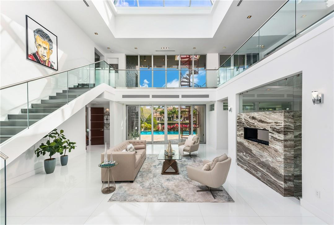 Custom designed modern luxury residence on a wide canal in the Las Olas Isles, built in 2015, dock up to a 90' yacht. Top-of-the-line chef's kitchen, gas fireplaces, elevator, integrated lighting & sound systems, pyramid skylight, impact windows, 4 energy efficient A/C's, motorized blinds, an outdoor oasis featuring a beautiful rooftop deck w/ artificial grass. Walking distance to restaurants and the beach. 6 beds - 7 baths - 2 half baths - 2 laundry rooms - office - theatre room - 3 car garage