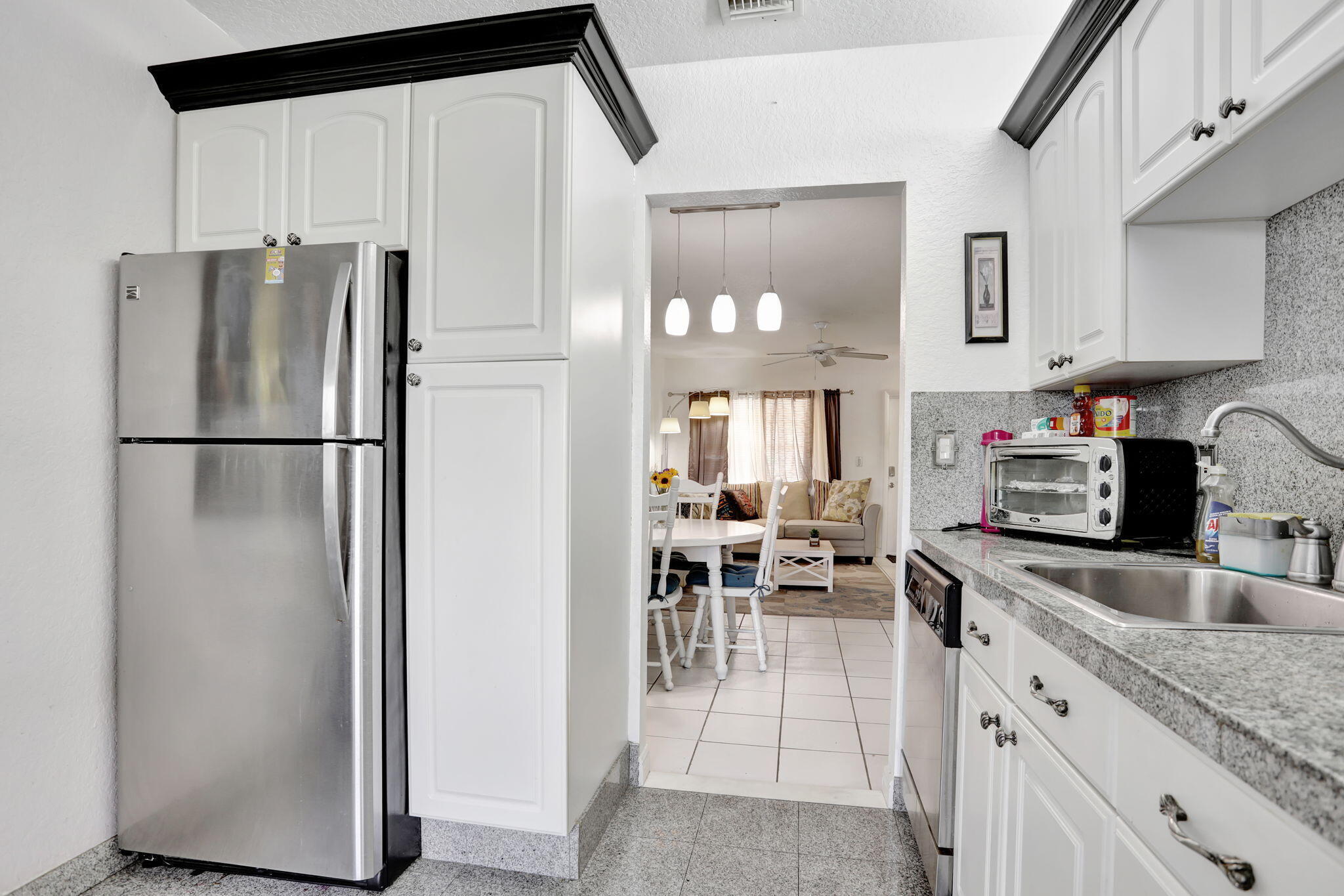 Beautifully maintained 1-bedroom, 1.5-bath unit located in a desirable 55+ South Florida community. This residence features a renovated kitchen, a spacious primary bedroom, and a private enclosed balcony—perfect for relaxing or enjoying the peaceful surroundings.  The additional half bath offers added convenience for guests. Residents enjoy access to a wide range of amenities, including social events, recreational facilities, and lush, well-maintained landscaping. The unit is offered fully furnished, with furnishings available for separate negotiation. This move-in-ready home presents an excellent opportunity to enjoy the comfort, charm, and active lifestyle of South Florida senior living.