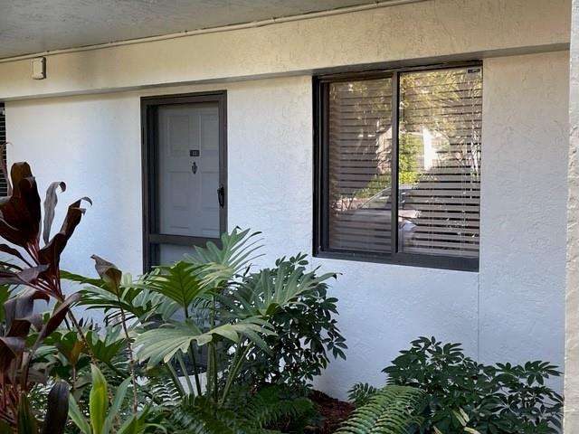 Park right in front of your delightful waterfront home, just steps from your private entry. No lobbies, stairs or elevators when you live here. Bright and cheery, your eye will quickly be drawn to the majestic water view. The screened and private patio lends itself perfectly to residents who enjoy tranquility. Direct access to green space and lakeside strolling right from the deeded patio. Many updates in recent years include newer hurricane shutters, all appliances & A/C. Cool tile floors throughout. Split bedroom plan maximizes privacy. Open kitchen & living areas deliver a spacious & contemporary feel. The amenities package at Cypress Bend VII is great; swimming pools, hot tub, gaming room, party room (nominal fee), management offc, grills, security cameras & more. Come see!
