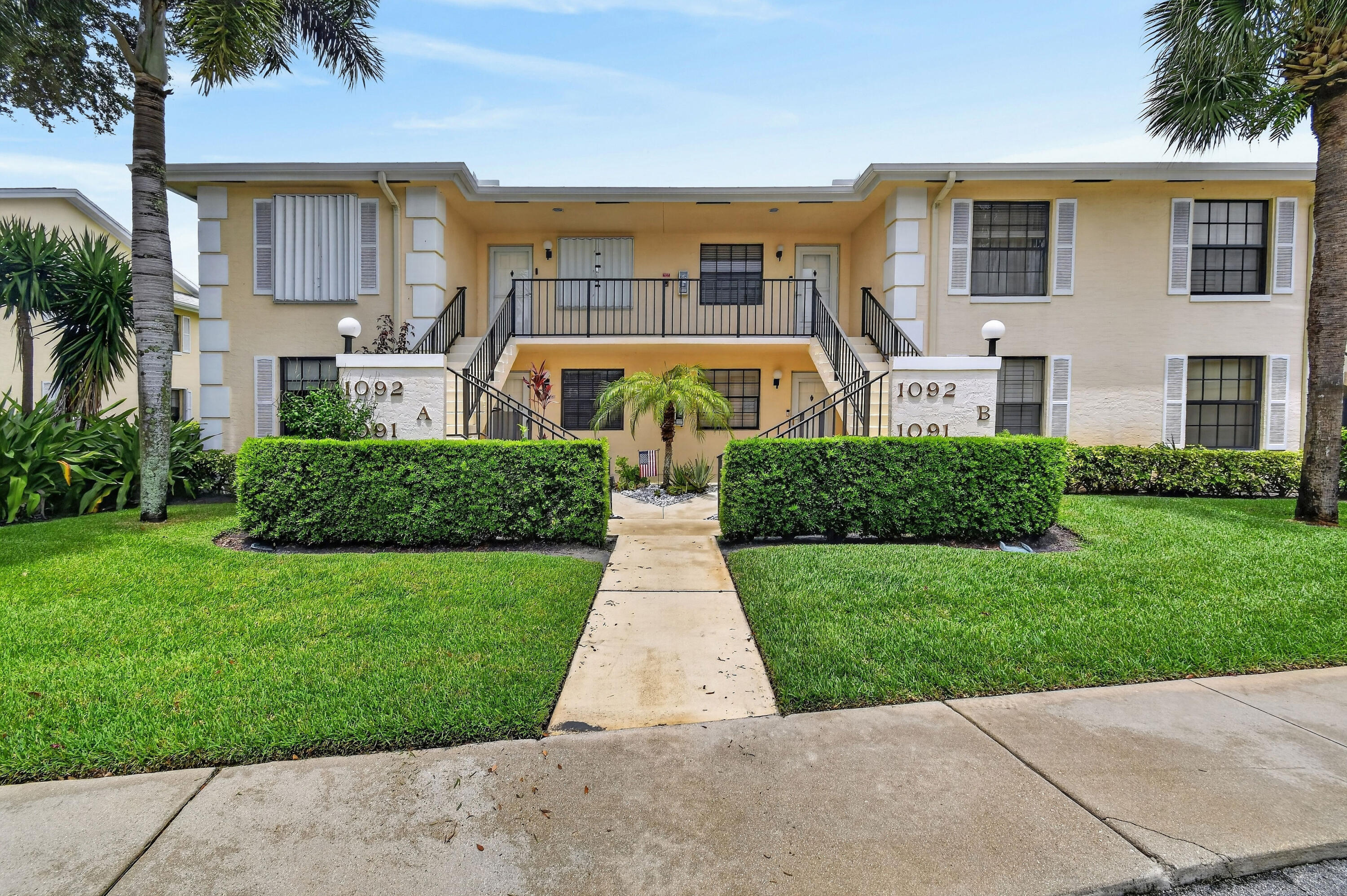 Welcome to this completely renovated LAKEFRONT first floor end unit located between 5th and 6th holes at The Golf Club of Jupiter. This is perfect Jupiter living as you watch or play golf by day and enjoy the sunset over the lake in the evening. This home has a  very nice and bright open floor plan with split bedrooms for privacy. The beautiful white kitchen has all soft close cabinets/drawers and has granite countertops. Entertaining your friends and family will be delightful centered around your large kitchen island. You will have peace of mind with all IMPACT GLASS, an electric hurricane screen for your back patio, and a  2024 ROOF! Enjoy the privacy and extra natural light of an end unit and the convenience of first-floor living. Keystone is a sought after community surrounded by  restaurants, shopping, Jupiter/Juno Beach, and within 15 miles of Palm Beach International Airport. Make your appointment today!