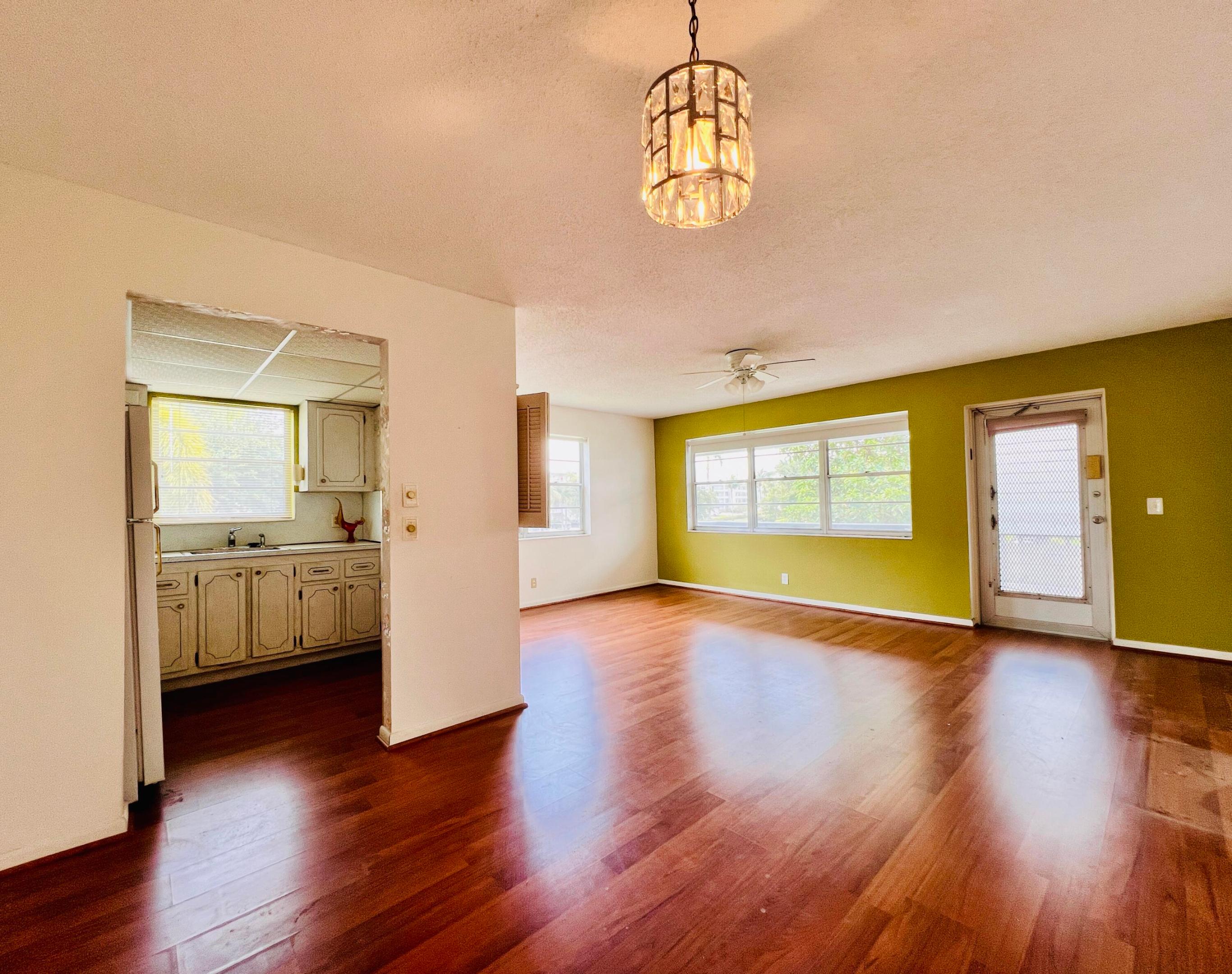 Cheerful & Bright In 55+ Century Village! Desirable CORNER 1/1.5! Gleaming Wood Look Laminate Flooring Flows Throughout. Spacious Bedroom Suite With Wall of Closets for Plenty of Storage, Full Ensuite Bath With Tub/ Shower, and Access to the Screened Lanai. Century Village is a Vibrant 55+ Community Centrally Located in Palm Beach County, Florida! Enjoy An Active Lifestyle With Resort Style Amenities....  Century Village is a 55+ Resort Style community with so much to offer - Much To Offer - shows, movies, clubs, pools, security, and transportation service. The Clubhouse features a theater, indoor pool, card room, community/party room, billiard room, shuffleboard, tennis, pickleball, bocce, and two outdoor pools, Numerous heated outdoor pools throughout the community. Separate fitness center with gym and outdoor heated pool & resistance pool. Two guarded gates and 24-hour roving security patrol.