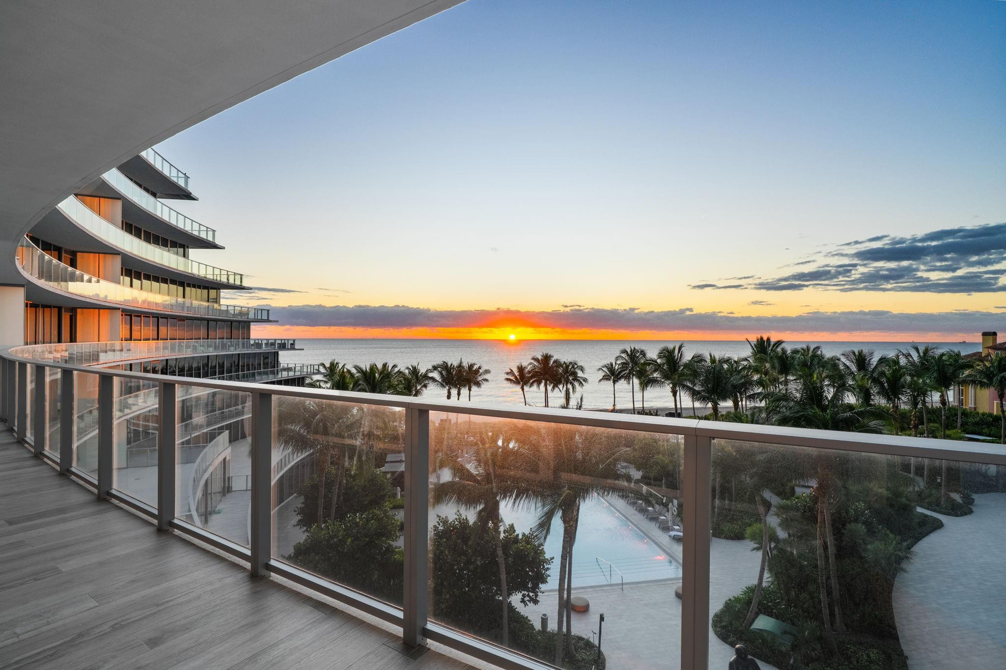 Experience opulent coastal living in this showstopping corner flow-through residence with panoramic exposure from ocean to city. Floor-to-ceiling glass nearly wraps the entire home, capturing direct sunrise ocean views to sunset Intracoastal and skyline vistas, with spacious terraces on both sides. Enter through a private foyer to blue porcelain herringbone floors, custom millwork, and an octagonal dining ceiling framing a designer chandelier. Features include 3 bed, media lounge & office, 5 baths, expanded primary suite with quartz dressing room, Control4 smart system for seamless luxury living. Auberge delivers the ultimate resort lifestyle with world-class amenities, beach and pool attendants, on-site dining at the new oceanfront restaurant Delmar, and holistic treatments at Evara Spa.