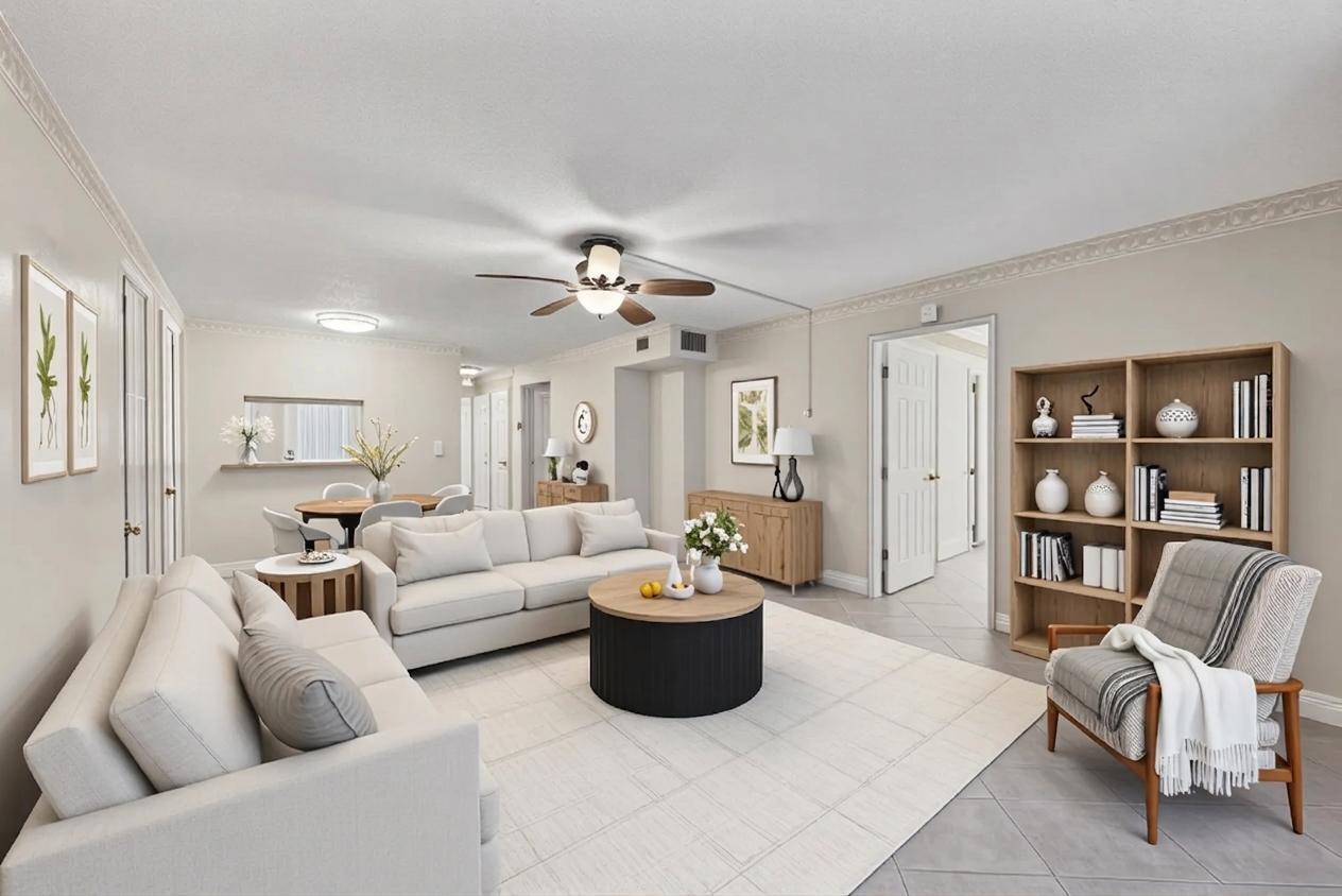 LOVELY EAST FACING UPDATED 2/2 second floor garden view unit in Deerfield Beach Gardens condo complex! Features include IMPACT WINDOWS AND ENTRY DOORS! 2025 AC and Hot Water Tank. Ceramic tile flooring, updated kitchen and appliances and updated bath vanities. COZY IMPACT GLASS enclosed patio overlooking heated POOL and manicured gardens w/ additional security featuring accordion and roll down shutters for peace of mind. ALL AGES WELCOME! GREAT condo for first time home buyers! Deerfield Beach is less than 2 miles away, and restaurants and shops are in walking distance. QUICK ACCESS TO I-95 make this unit a GEM!   Exterior building freshly painted, new asphalt, and condo has a 2022 roof. 2023 structural report available.