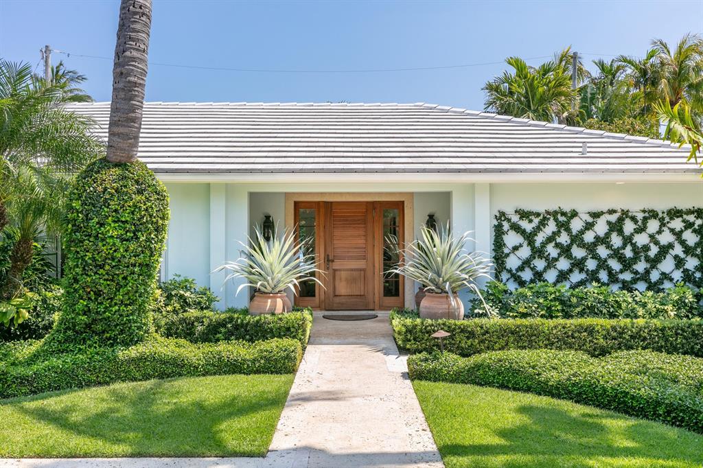 Gorgeous 3BR/2.1BA one story home on the ocean block of Atlantic Avenue. Fantastic In-Town location with ocean access at the top of the street. Located on the sunny South Side of the road with beautiful, lush tropical landscaping, covered loggia, and private pool. Light and bright home with formal living and dining rooms, family room, impact glass, and two car garage.