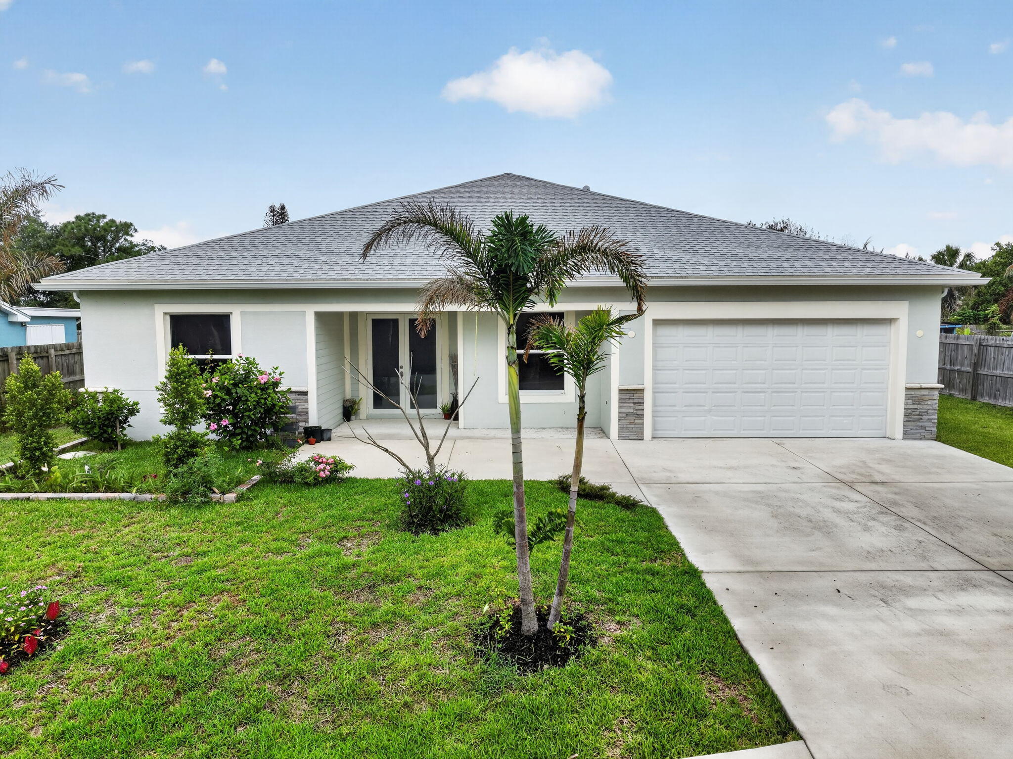 Brand-new construction in Port St. Lucie offering an impressive 3,400 living square feet of beautifully designed space! This stunning home features a modern open-concept layout with expansive living areas, soaring ceilings, and abundant natural light throughout. Designed for both comfort and entertaining, the spacious floor plan includes generously sized bedrooms, elegant finishes, and a stylish kitchen perfect for gatherings and everyday living. The luxurious primary suite offers a private retreat with ample space to relax and unwind. Enjoy the benefits of new construction with energy-efficient features and low-maintenance living. Conveniently located near shopping, dining, parks, schools, and major highways. Exceptional space, modern design, and endless possibilities await — schedule you