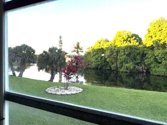 Beautiful tranquil setting on a winding lake overlooking the Century Village Nature Preserve. Very active 55+ community. Loads of athletic and social activities, including a fitness center and theater. First floor location with parking close to the front door. Freshly painted.  All residents must be 55+. No rentals allowed.