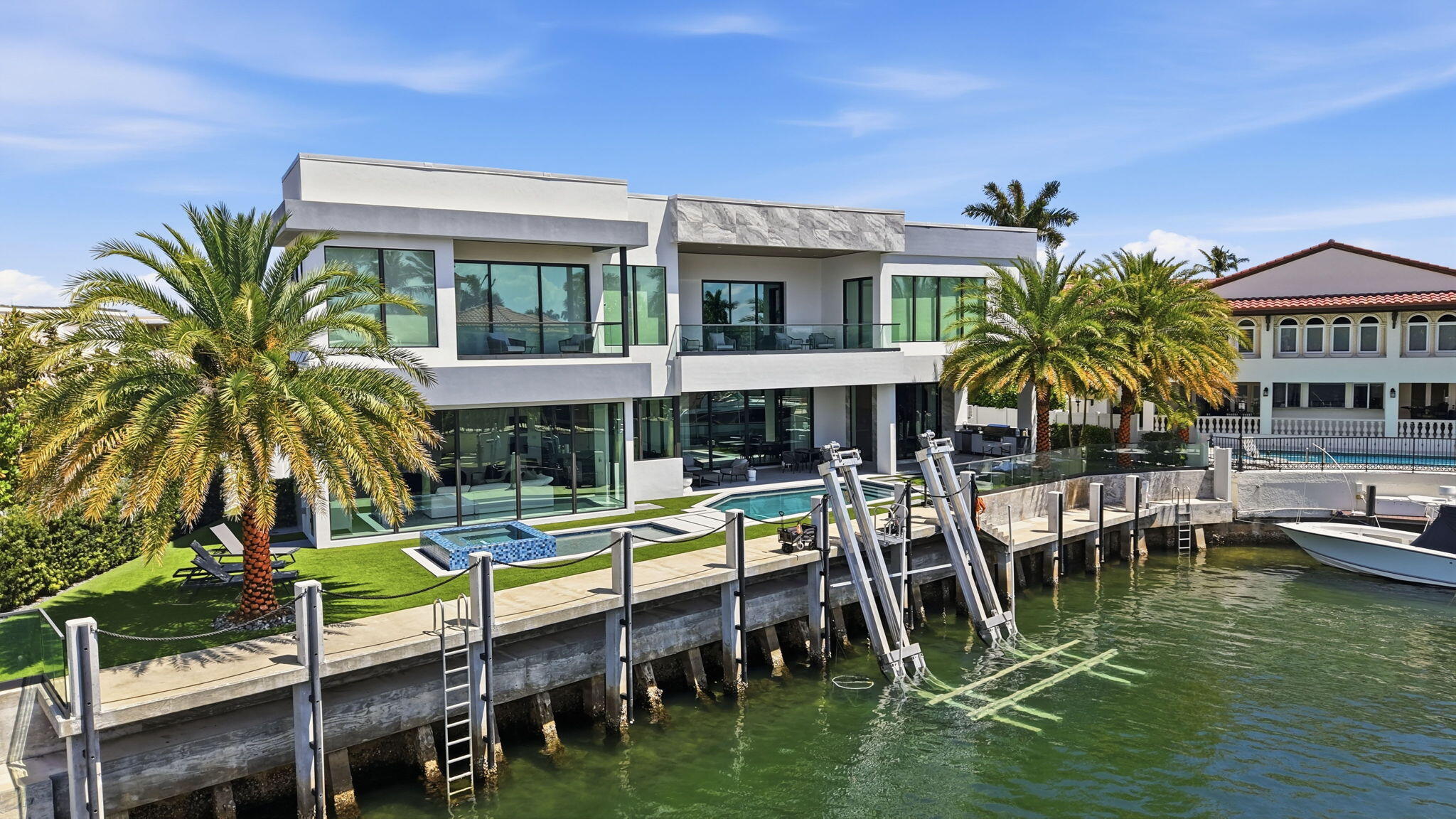 Welcome to 749 Bamboo Drive, a contemporary waterfront masterpiece located in the prestigious Sun & Surf enclave of East Boca Raton. Built in 2023 and offered fully furnished, this exceptional residence encompasses 7,502 square feet of sophisticated interior living space with 6 bedrooms and 8 bathrooms, blending modern elegance with seamless functionality. Perfectly positioned on 132 feet of waterfront with direct ocean access, this home is ideal for the boating enthusiast and offers the ultimate South Florida lifestyle.    Designed for both grand entertaining and everyday luxury, the residence features open, light-filled interiors, soaring architectural lines, and a seamless indoor-outdoor flow. The chef's kitchen is a true showpiece, appointed with a 72-inch Sub-Zero refrigerator,  6-burner Wolf gas range, dual Wolf wall ovens, and a 57-inch Ruvati two-tier workstation sink, creating an exceptional culinary environment.    Outdoor living is equally impressive, with expansive waterfront vistas, exceptional dockage potential, and rare walkability to the beach. Located just moments from The Boca Raton and its Beach Club, this residence offers unmatched proximity to Boca Raton's finest dining, golf, and resort amenities. A rare opportunity to own a turnkey new construction waterfront estate in one of East Boca Raton's most exclusive neighborhoods.
