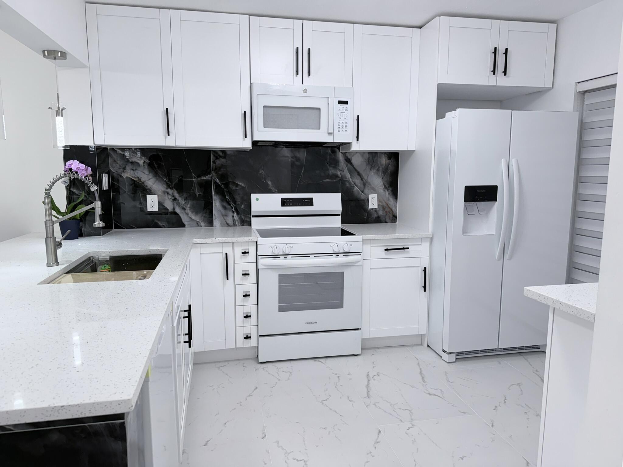 Prime location! This condo has ample rooms and plenty of natural light, conveniently situated on the first-floor corner with access to a beautiful green area, great for families and outdoor gatherings. Only 3 mins to I-95, 7 mins to the beach, 3 mins to Aldi, 5 mins to Publix, 10 mins from Boca Raton Town Center Mall. This apartment features a brand-new remodeled kitchen, with new appliances and new tile flooring and impact windows to be installed prior to move. Boca Raton has the highest number of schools with an A grade across all levels in Palm Beach County. This property is within a well-maintained condominium that has a janitor and a heated pool and community center available all year round.