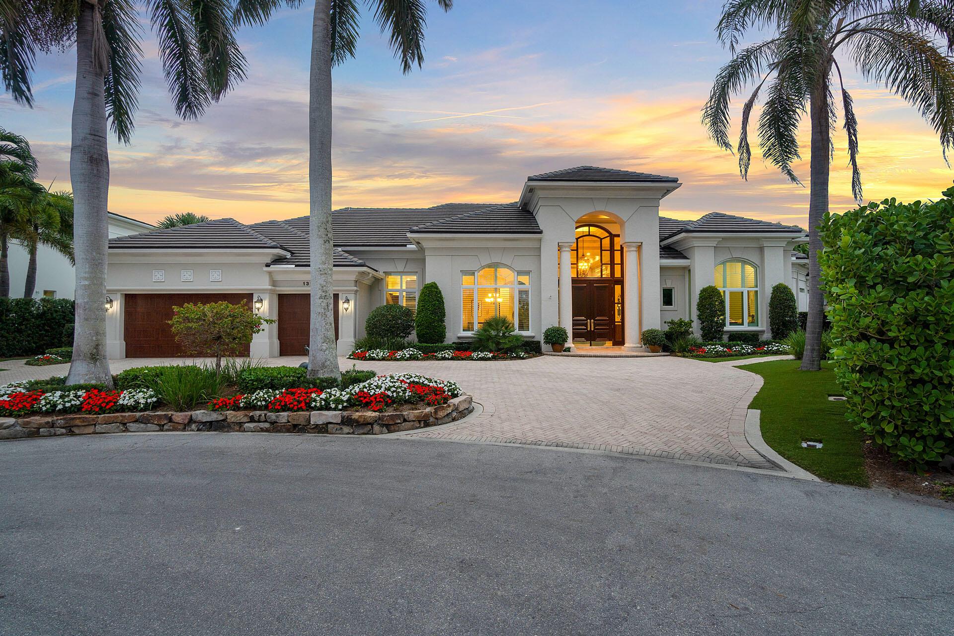 Welcome to 132 Thatch Palm Cove, single-story home on a quiet cul-de-sac in the prestigious Royal Palm Yacht & Country Club. Located on 163' of Jack Nicklaus Signature Golf Course's 5th hole, this home features volume ceilings, an open floor plan into the living room with entertainer's bar and fireplace, formal dining room, private office, stunning kitchen with premium appliances, and a spacious family room with pool and golf course views. The owner's suite has large ensuite bathroom and separate His & Her walk-in closets. The backyard features golf course views, built-in grill area, heated pool and a raised spa.
