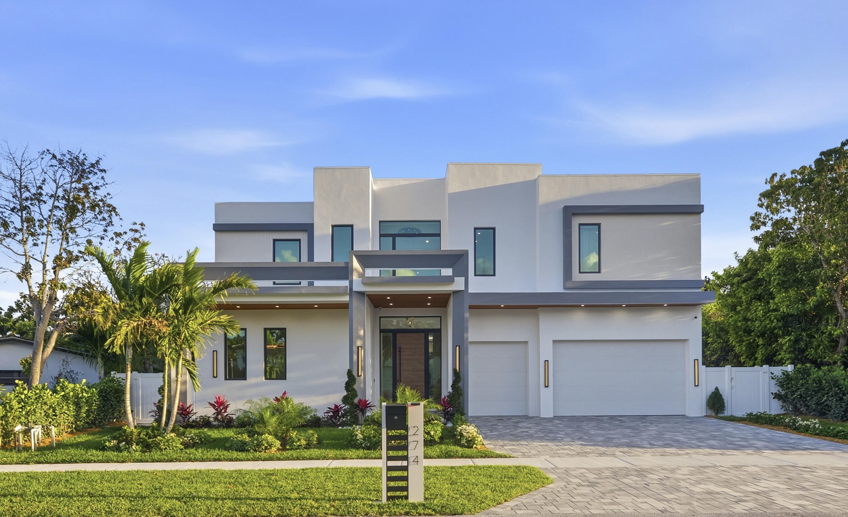 Welcome to Casa del Sole, an exceptional modern estate crafted by Yacov Development, where superior construction meets elevated design in the heart of Boca Villas. Perfectly positioned within walking distance to Mizner Park, Boca's pristine beaches, and The Boca Raton, this residence offers an unmatched blend of luxury and lifestyle. Designed with sophistication and functionality in mind, the home showcases premium finishes and advanced smart home technology throughout. The chef's kitchen is a true showpiece, featuring Cristallo countertops with illuminated island and backsplash, sleek Italian wood veneer cabinetry, and a full suite of top-of-the-line appliances including Sub-Zero refrigeration and Wolf double ovens, 48-inch range, built-in coffee system, microwave and two Cove dishwashers.  The open-concept living areas are enhanced by oversized Italian 48x48 porcelain tile, floating ceiling with custom lighting, automated blinds and shades, and curated Italian furnishings. Multiple living spaces include a dedicated office and expansive media-ready wall designed to accommodate oversized displays.   Upstairs, engineered hardwood flooring flows throughout, complemented by a spacious loft and an additional laundry room. Both levels feature luxurious primary suites and thoughtfully designed layouts for comfort and privacy. Spa-inspired bathrooms include Cristallo integrated sinks, Signature smart toilets, large slab tile, custom mirrors, and linear shower drains.   Step outside to your private resort-style retreat, complete with a 38' saltwater pool with LED lighting and natural gas heating, marble pavers, and a fully equipped outdoor kitchen with DCS grill and Taj Mahal countertops.   Additional outdoor highlights include a cabana bath and an outdoor shower.   Bonus premium features include: Elevator, Control4 smart home system, Imported Italian doors with concealed hinges and magnetic latches, security cameras, generator-ready infrastructure and custom built-out closets throughout. Garage features metallic epoxy flooring and has car-lift capabilities.