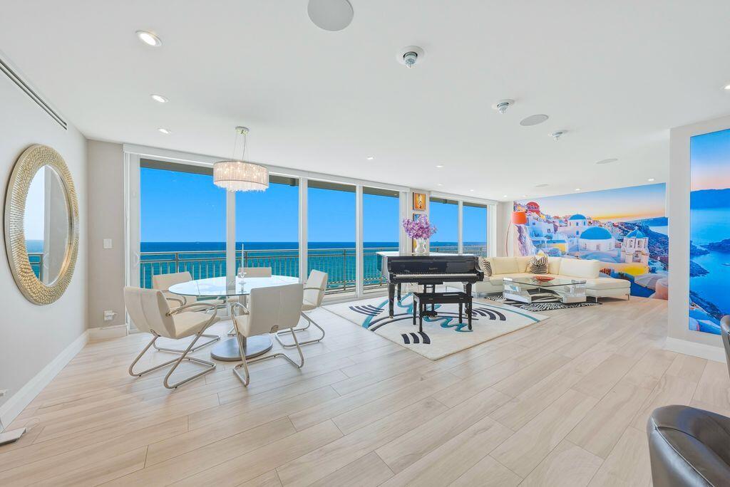 Stunning direct ocean 3/3.5 masterpiece in the prestigious Aegean.  Elevator entry into your private foyer welcomes you to your paradise on the entire 4th floor designed for ultimate luxury. Floor-to-ceiling impact glass with stacking sliding doors blend indoor and outdoor living, opening to a spectacular wraparound balcony with sweeping views of the sparkling Atlantic Ocean. Gourmet chef's kitchen features an expansive island and sunlit breakfast area. The luxurious primary suite offers a serene retreat and spa-inspired bath. Each bedroom with terrace and en-suite bath, ensuring comfort and privacy for family and guests alike. Enjoy the resort-style oceanfront pool with raised lounge area and private gated beach access shared by only 8 residences-a truly spectacular beachfront lifestyle. This residence includes smart home technology, 160 bottle wine storage, 2 garage parking spaces and secure private entry.