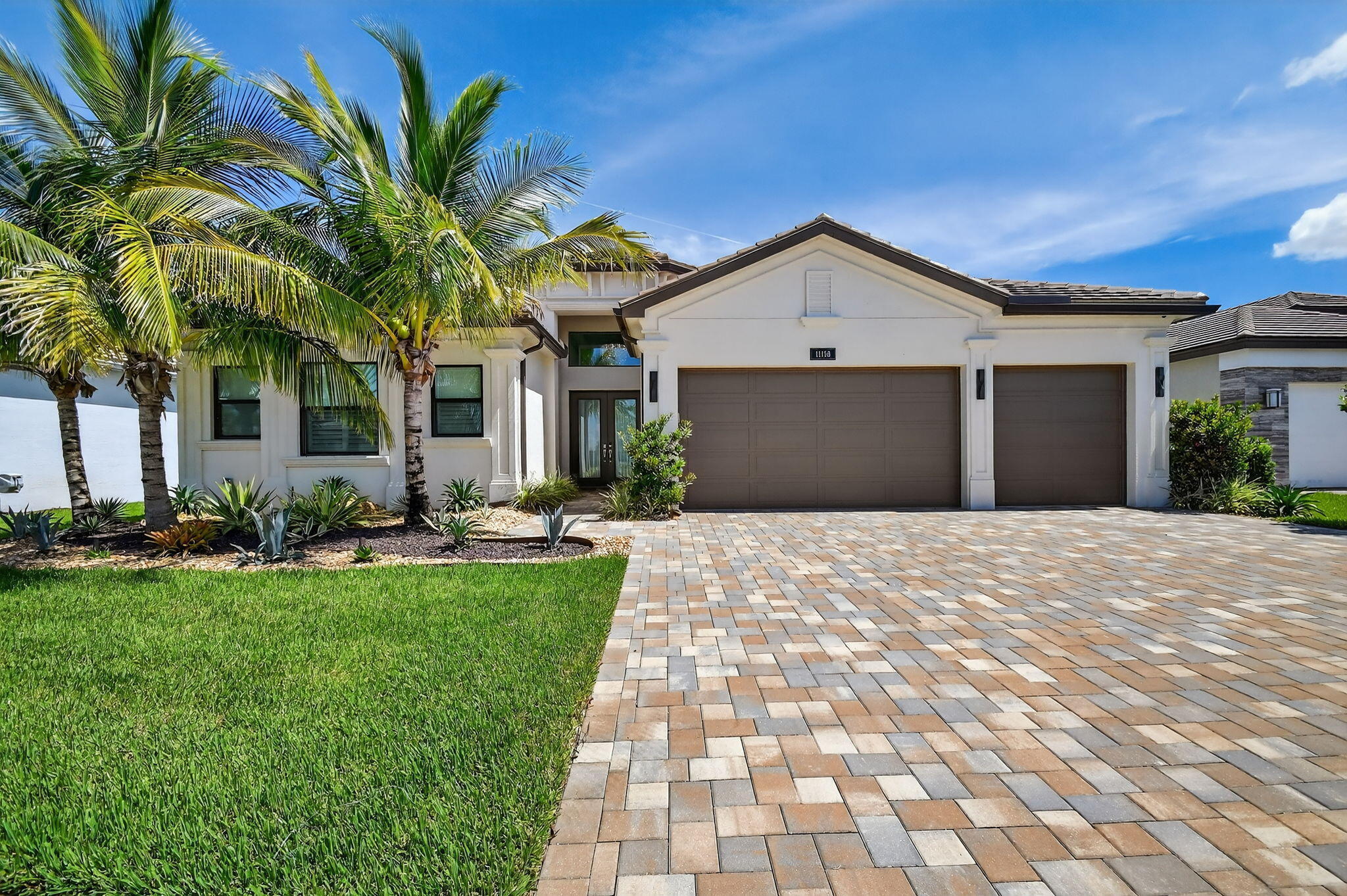 LUXURY AND PRIVACY!! Best "water view" with no houses to see! Special 1-story 4 Bedroom/4 Bath Charleston Grande Crown model is a 3,277 sqft WOW HOME in Valencia Grand. Amazing value with all the upgrades and full feature pool/spa! Move-in Ready! Live the Active 55 country club lifestyle with NO EQUITY and NO ANNUAL DUES! SEE ATTACHED FEATURES LIST ON THIS NEARLY NEW GORGEOUS HOME -- the ONLY CROWN model with side-by-side straight-in expanded 3-car garage for easy drive-in. The courtyard-feel backyard feels like a PRIVATE boutique resort, landscaped - serene with ceiling speakers for your spa or music listening pleasure. Step past the specialty-glass double doors and you'll be greeted by a 15ft tray ceiling height and see a glamorous private oversized backyard offering magnificent pool  and stone hot-tub spillover, soothing bubbler and deck fountains, beige honed marble patio -- your own private paradise!  The pool has 5 steps for ease on knees and kids, an in-pool walking path, a swim lane and custom color artisan handrail. Front of house feels open just off the cul de sac with no house directly across the street -- rare in these gated communities. House comes with Natural Gas for stovetop & outdoor grill so no propane tank inconveniences. Outdoor Kitchen has sink, side-burner, storage, minifridge and porcelain tile backsplash.   Features include: 36'x36" white marble-like porcelain tiles, crown molding, high tray soaring ceilings, mini-bar, marble electric fireplace focal wall unit, designer wallpaper, and DAZZLING name-brand lighting fixtures, Arctic White (level 6) glossy modern cabinets with pullouts in kitchen and all bathrooms, Walk-in Pantry with pullouts, Quartz waterfall kitchen Island, Spectacular Natural Mother-of-Pearl Silver Minibrick backsplash. Designed for Easy Entertaining at Kitchen bar or in Formal Dining Room, Eat-In Kitchen, or Outdoor Patio. GE Profile appliances. Club Room converted to 4th bedroom/home gym/office with 2 closets and Specialty Glass 96" doors and designer long handles, Equipped with 5-zone Sonos System throughout home inc. Surround Sound Media in Family Room. Upgraded shimmering Blue Pearl Granite Countertops in Bathrooms, Listello accent tiles, Undermount Tub with Granite Counter (for Safe & Easy Sitting on side and for entry into tub), and Framed Mirrors throughout. All Toto toilets. Crystal-like Shower handle in Main bathroom. Motorized Shades throughout. Extra long 3-car garage has sparkling finished floor, storage cabinets, fan and EV electric car charger. Whole House RainSoft Water Purification System. Closet Factory systems. Transferable CAC Service Contract. 2 AC zones.   House vibrates incredible aura DAY AND NIGHT with natural light, magnificent chandeliers, sconces, pendants and outdoor lighting. Lighting fixture top brands are Swarovski, Allegri, Eurofase, Dale Tiffany, Modern Forms and others. The roof has been specially sealed to reduce color fade and prolong roof life. This model features a spacious laundry room and a large hidden storage room which is near plumbing line for a 5th bathroom if desired.   WALKABLE AND QUICK DRIVE, CLOSEST SECTION TO CLUBHOUSE AND MAILBOXES!!  Widened, long driveway accommodates 9 cars.  NO zero lot line. A Dream Home with a Country Club Lifestyle without the fees! Landscaped for easy maintenance! Active community boasting INDOOR Pickleball courts, full tennis program, FULL restaurant, social clubs and fulltime activities director, natural gas cooktop, full service salon and spa and MORE in this 44,000 sqft modern clubhouse!   Outdoor sculpture by renowned artist in backyard will be included with a full price offer.  Zillow and Realtor estimates are $2.7 and up!!
