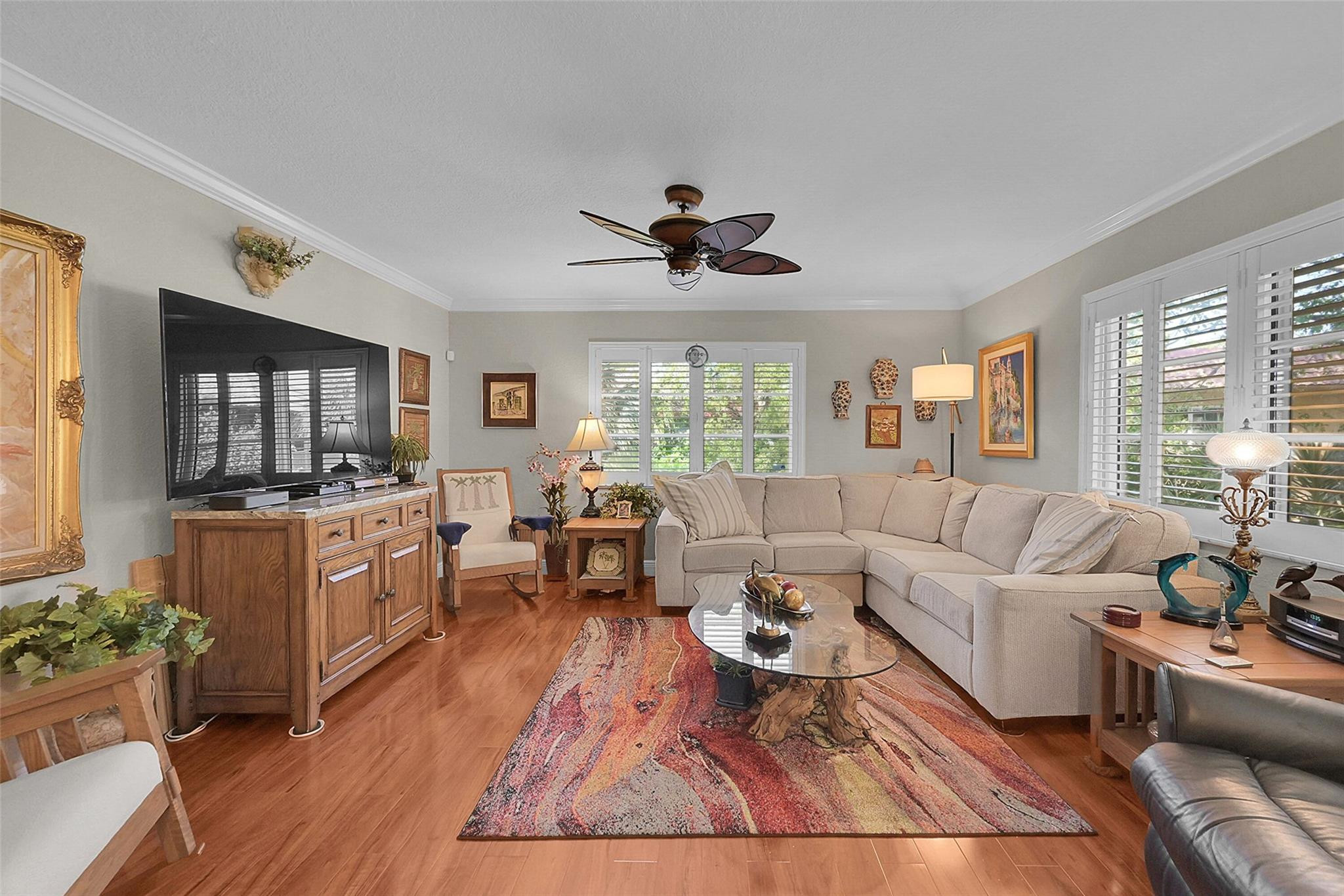 Beautifully FURNISHED or Unfurnished corner 2/2 unit in highly sought-after Manor Grove II—just needs a happy new owner! Enjoy one of the community's best locations with peaceful treetop views. This light & bright home has been updated top to bottom, including major "big ticket" improvements you don't always see. Stunning kitchen with ample counter space plus two custom pantries. Open-concept living & dining perfect for entertaining. Beautiful custom flooring throughout. Both bathrooms fully updated with oversized glass shower doors—perfect for tall buyers. All impact windows & plantation shutters. Washer & dryer in unit. Relax poolside at the community pool & clubhouse. Minutes to Wilton Drive nightlife, dining, and shopping. Move-in ready and impeccably maintained! Min. Credit Score 675.