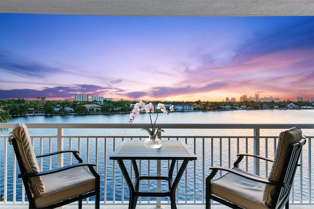 SPECTACULAR SOUTH CORNER UNIT WITH WRAP AROUND BALCONY RARELY AVAILABLE! BEAUTIFULLY RENOVATED WITH PHENOMENAL DIRECT INTRACOASTAL & CITY SKYLINE VIEWS! OPEN FLOORPLAN WITH NEUTRAL MARBLE FLOORS IN THE LIVING AREAS AND CARPET IN THE BEDROOMS. CUSTOM DESIGNED KITCHEN WITH STAINLESS STEEL APPLIANCES, GRANITE COUNTER TOPS, RAISED BREAKAST BAR & WASHER & DRYER. PRIMARY BEDROOM COMFORTABLY FITS A KING-SIZED BED, DESK & LOUNGE CHAIR. BOTH BATHS HAVE GRANITE COUNTER TOPS. CUSTOM LIGHTING, SUNSHADES. PRIME GARAGE PARKING SPACE, STORAGE CAGE, & BOAT SLIP FOR UP TO A 25' VESSEL ARE INCLUDED. AMENITIES INCLUDE HEATED SALINE POOL, BBQ-GRILL, GYM, SAUNAS, SHOWERS, BILLIARD ROOM, CLUB ROOM/KITCHEN, ROOF TOP SUN DECK & MORE. PHENOMENAL LOCATION ONLY A FEW SHORT BLOCKS TO FORT LAUDERDALE BEACH!