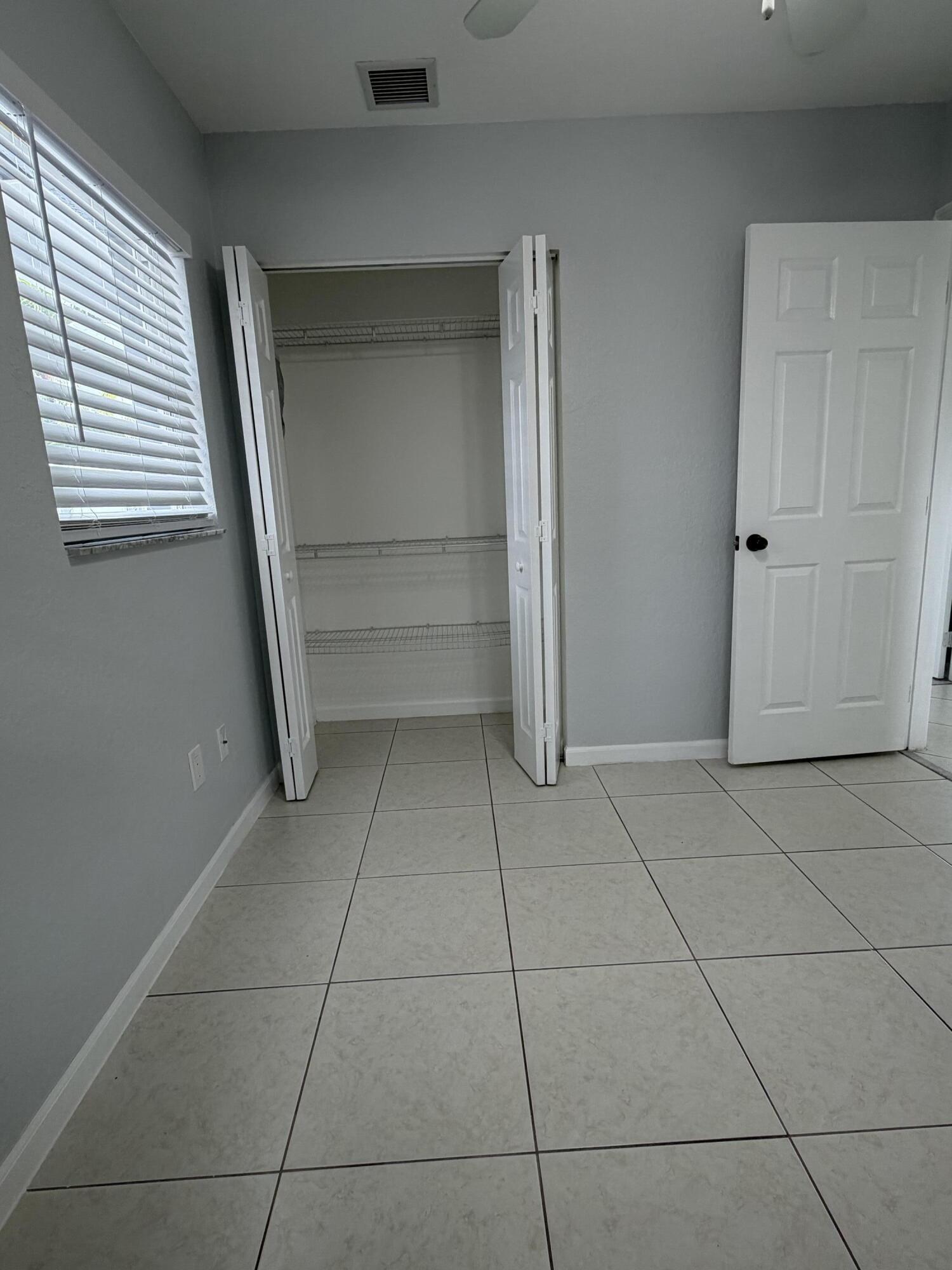 Welcome to this charming 3-bedroom, 2-bathroom single-story residence in the Lake Worth Hills 2nd Addition community of Greenacres, Florida. This well-proportioned home offers 1,101 square feet of finished living space on one convenient floor, eliminating the need for stairs and creating an open, accessible layout. The thoughtful design provides comfortable accommodations for various living arrangements and entertaining needs. Situated in an established residential area, this property presents an excellent opportunity for those seeking a practical home in a developed community.