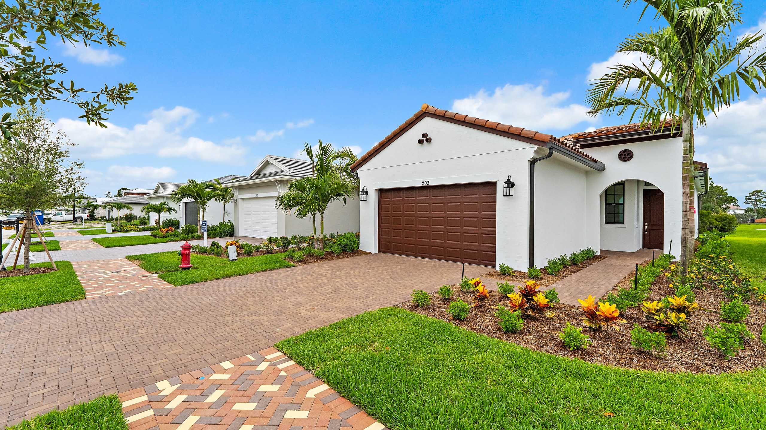 Don't miss the final Caroline floorplan on the Lake! This beautiful Mediterranean-style home sits on a west facing homesite with stunning lake and sunset views. Inside you'll find laminate flooring throughout the main living areas and a thoughtfully designed gourmet kitchen featuring a gas cook top, wall oven and microwave combo, perfect for a seasonal home in Florida! The Caroline offers an open, easy flow layout that's perfect for enjoying Florida living whether you're here for season or year-round. Located in Rivella, a gated community right down the street from the Saints Golf Course, walking distance from the up-and-coming Port District, and minutes from the RPS School and the newly renovated Sandpiper Resort.
