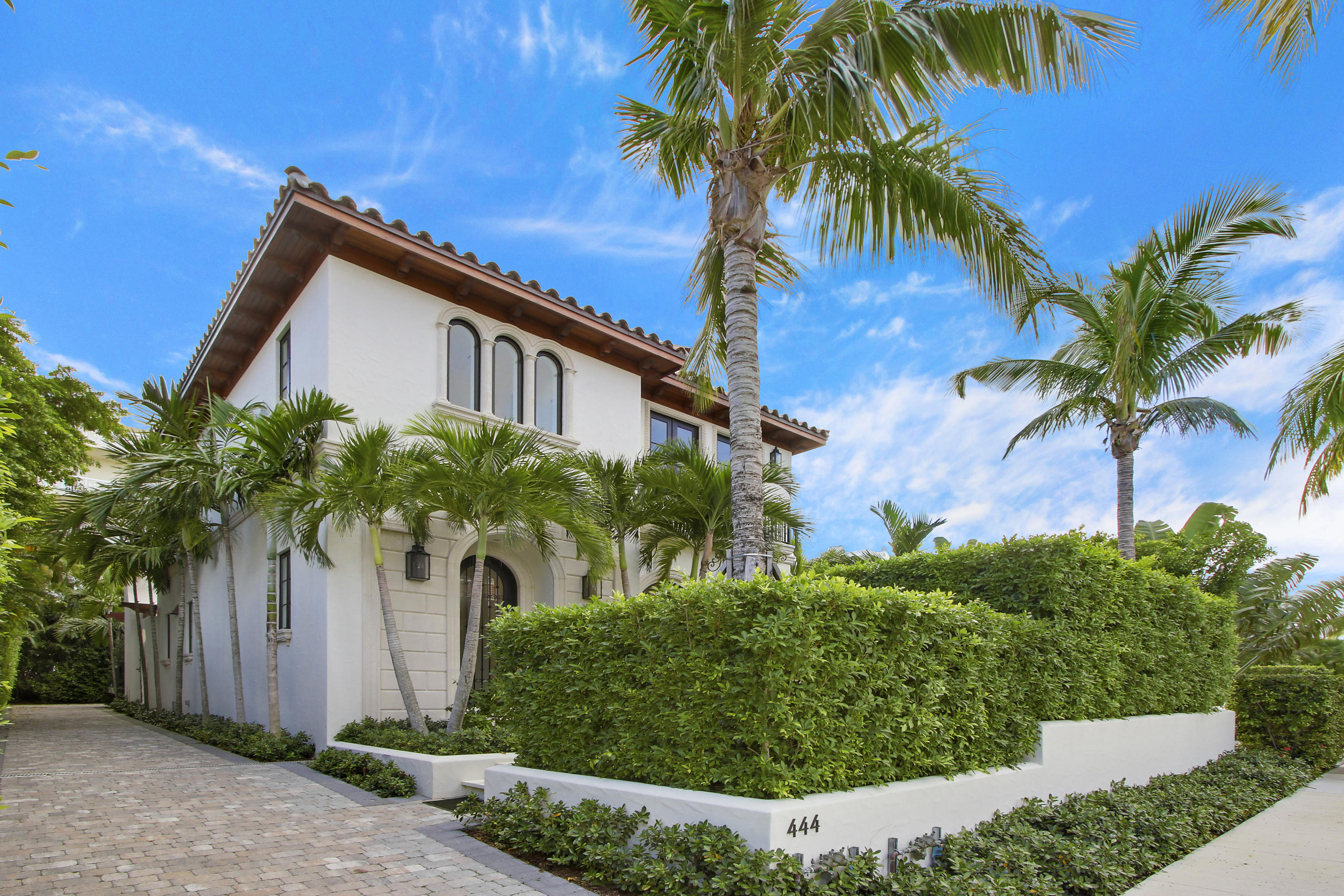 Brilliantly designed new construction opportunity just steps to Worth Avenue's fine dining, shopping, the intracoastal & bike path.  The immaculately built Mediterranean-style home boasts an array of high quality finishes, including soaring 13' ceilings on the first floor, paneling in the library, impact glass throughout and stunning intracoastal views from the second level.  A grand foyer leads into the main living space, offering residents bright views of the back lawn, built in cabinets and walnut flooring.  The kitchen is completely stocked with top-tiered appliances, granite counters and hosts a farmhouse sink overlooking the living space.  Outside of the home's french doors lies an outdoor sanctuary, complete with a saltwater swimming pool, an abor-covered patio & outdoor fireplace.