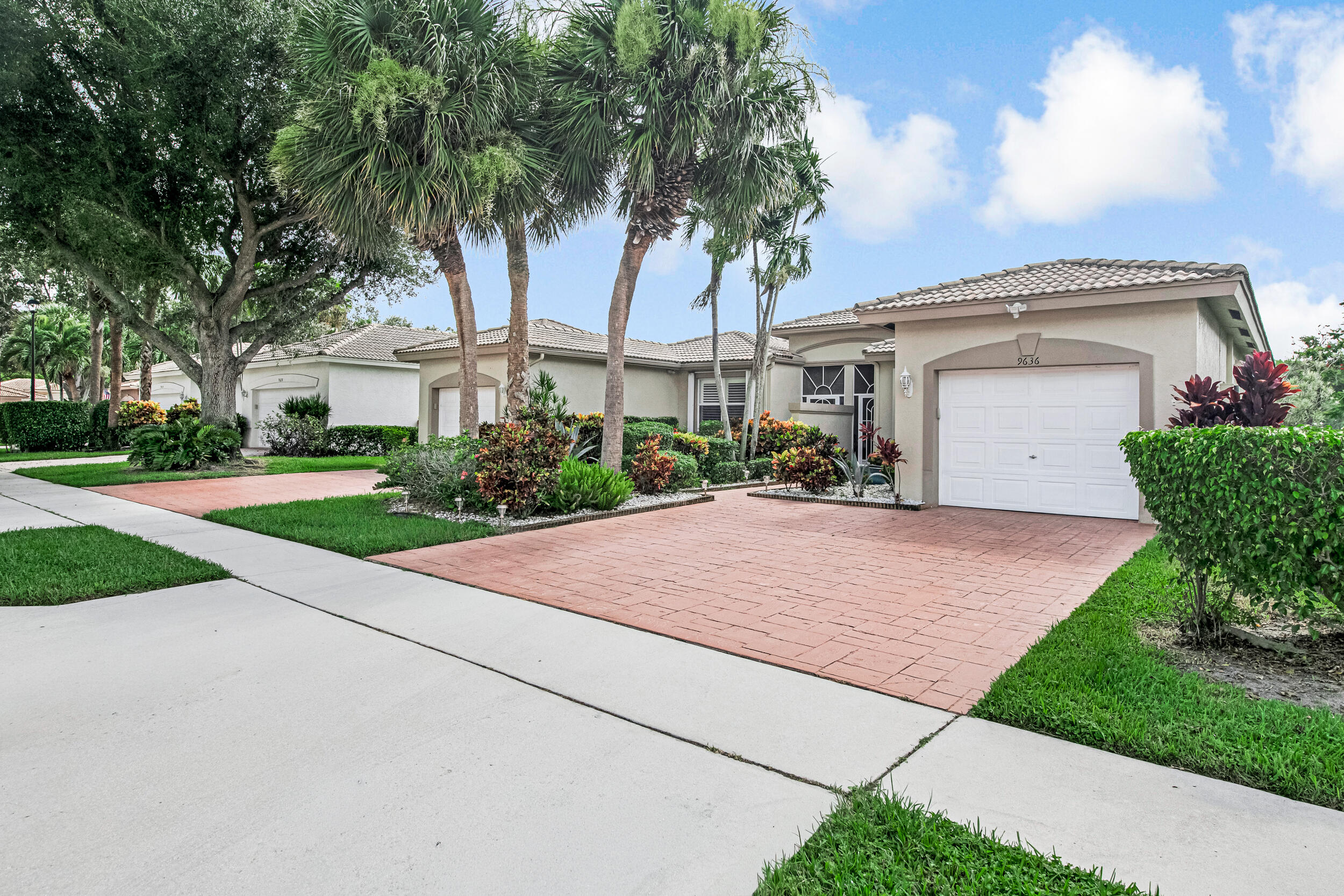 Completely renovated and exceptionally well maintained, this move-in ready home features a hurricane impact front door, accordion hurricane shutters, and a retractable awning over the screened patio, keeping you extra comfortable while enjoying your lake view. Inside is all porcelain commercial grade flooring throughout with no thresholds in the doorways, creating a seamless flow & crown molding in living areas. The updated kitchen and bathrooms offer a modern feel, & the kitchen includes large pantry. The spacious primary suite features a walk-in closet w/additional added closet.  Inside laundry room and one-car garage complete this well-appointed home. Check out the interactive 3D walkthrough tour for an "in person" view! Don't leave without stopping by the fully renovated clubhouse! Palm Isles Amenities Include:  *Professional Grade Har-Tru Pickle Ball & Tennis Courts w/Onsite Tennis Pro  *Multiple Pools  *Main Pool is heated in winter and cooled in summer  *On Site Cafe open for Breakfast & Lunch 7 days a week  Fully Renovated 54k sqft Clubhouse featuring:  *Elegant Lobby & Lounge Areas 600+ Seat Theatre for Shows & Live Performances  *Grand Ballroom  *Multiple Card & Game Rooms  *Billiard Room  *Meeting Rooms  *Pottery Room w/ Kilns  *Arts & Crafts Room  *Full Gym w/ Machines & Freeweights  *Aerobics/Yoga Room w/ Classes  *Library  *Indoor Pool  *Sauna  *Whirlpool  *Clubs & Activities For All Interests Including:  *Mens & Women's Social Groups  *Travel Groups  *Art Club  *Book Club  *Pap Corps Chapter  *Hadassah Chapter  *Chess Club  *Tennis & Pickleball Groups  *Fishing Club (all lakes are stocked)  *Card & Game Groups  *Swimming & Watersports Clubs *Gardening Club  *Chorus Groups  *Theatre Groups  *Tai Chi Group  *And Many More...