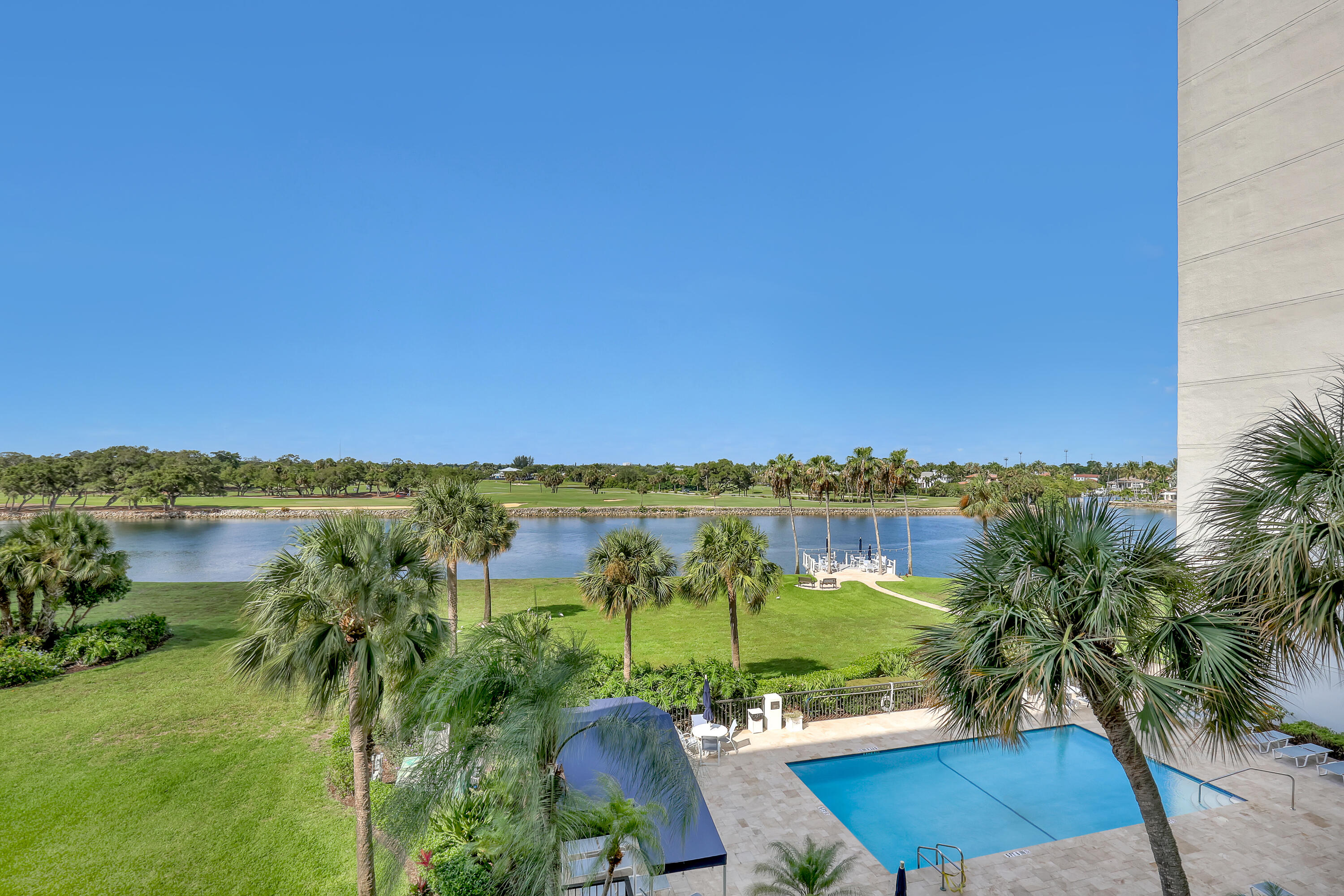 Imagine waking each morning to shimmering Intracoastal views and warm ocean breezes drifting through your balcony doors. Just across the waterway sits the North Palm Beach Country Club — a public club where you can tee off at sunrise, finish your round, and settle in for lunch at their waterfront restaurant. Back home, take a dip in your resort pool, then stroll down to your private waterfront observation deck and watch the boats drift by — the same spot where the legendary Christmas Boat Parade floats past every year. The turquoise Atlantic is minutes away, and the surrounding area offers world-class dining, Whole Foods, Trader Joe's, and top medical facilities. Great bones, extraordinary location, ready for your vision. Come and see it.  You'll never want to leave.