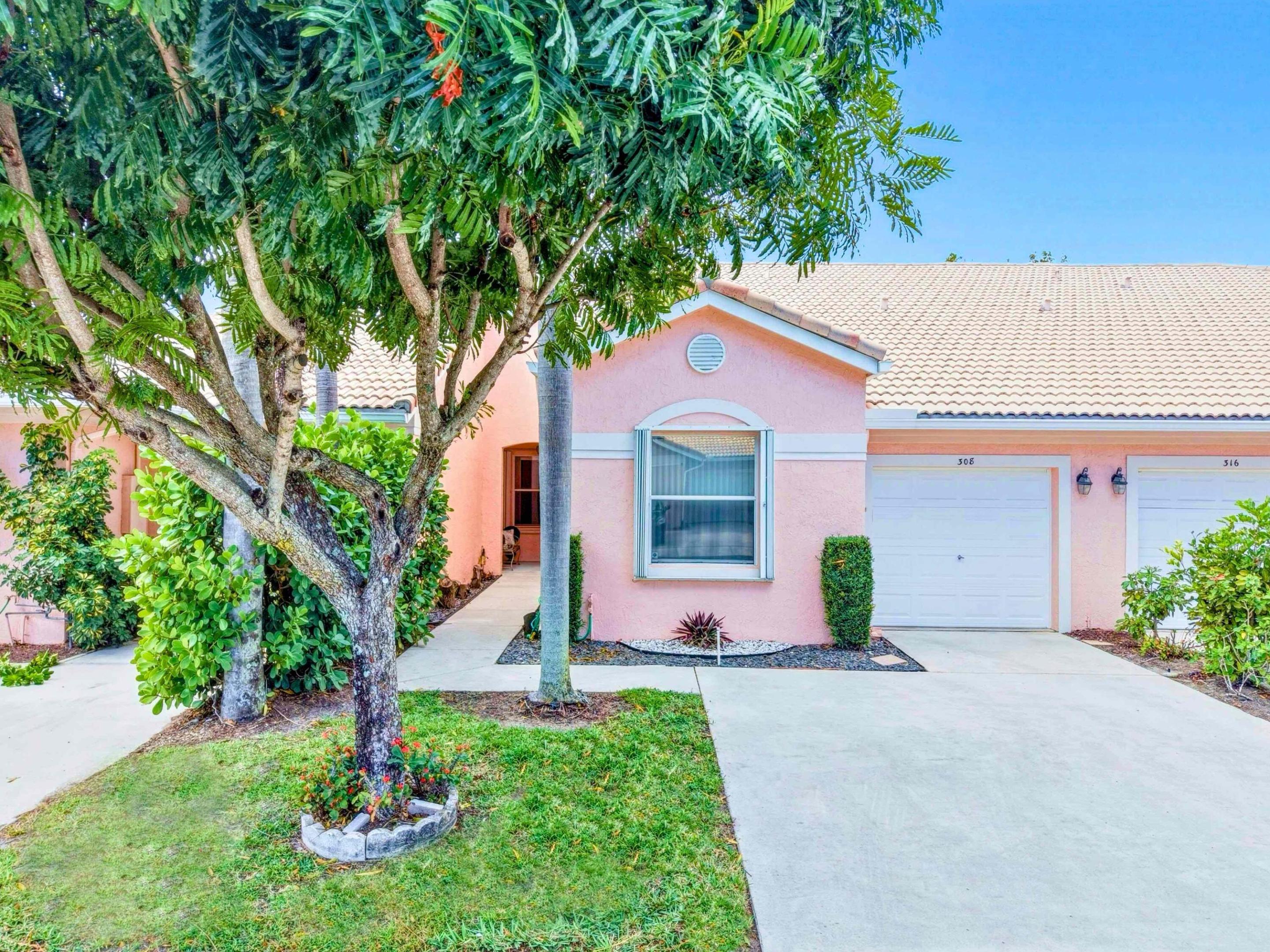 Experience the best of South Florida living in this beautifully maintained 2-bedroom, 2-bath home with corner lake views, soaring vaulted ceilings, and a bright open floor plan in a desirable all-age private community. Just minutes from downtown Delray Beach's shops, dining, entertainment, and pristine beaches, this move-in-ready home features an updated kitchen with leather-textured matte granite countertops and a split-bedroom layout for added privacy. The spacious living and dining areas are filled with natural light, creating a warm and inviting atmosphere for everyday living and entertaining. Enjoy low HOA fees, a well-maintained neighborhood, and no rental restrictions, making it ideal for full-time residents, seasonal owners, or investors.  The nearby Delray Beach Golf Club is undergoing a complete restoration and is scheduled to reopen in November 2026, adding even more value and appeal to this sought after location.