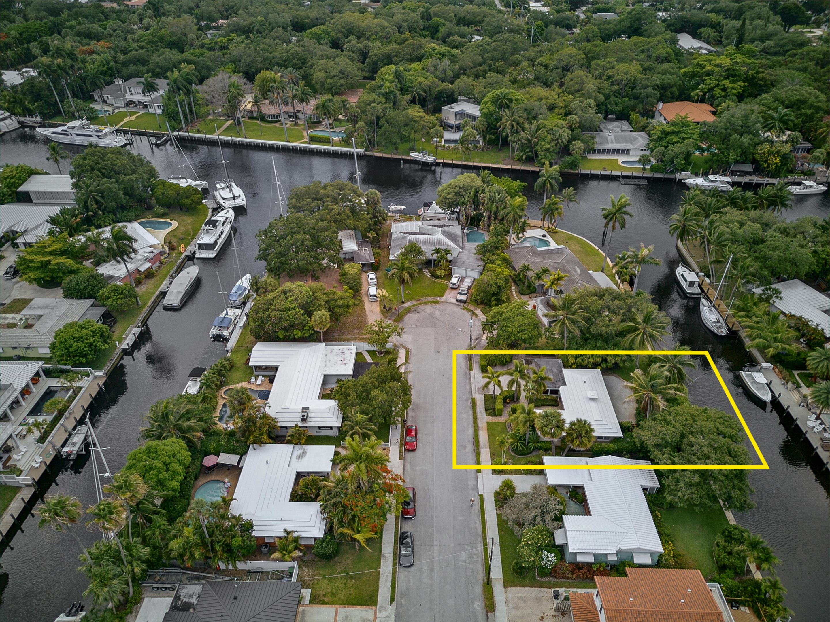 Tucked within the sought-after Citrus Isles section of Fort Lauderdale, this waterfront residence offers the quintessential South Florida lifestyle. Situated on an oversized lot just one home from a coveted point lot, the property boasts 75 feet of prime waterfrontage, sweeping New River views, and a newer 75-foot dock with water and electric hookups. With no fixed bridges between you and open water, this is an ideal berth for yachts and sailboats up to 65 feet — everything a serious boating enthusiast could ask for.  Whether you're launching from your private dock, cruising the New River, or heading out to the Intracoastal, this is a rare opportunity to embrace the boating life, which is just minutes from downtown Fort Lauderdale and the Fort Lauderdale-Hollywood International Airport!