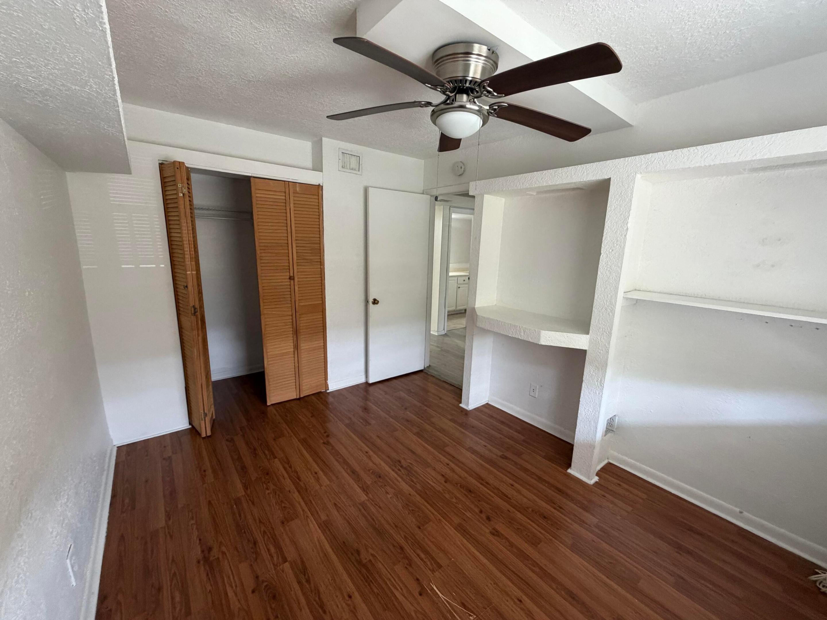 Welcome to this beautifully maintained top-floor three-bedroom, two-bathroom condominium in the desirable community of Coral Springs. This light and bright home features soaring vaulted ceilings, abundant natural lighting, updated flooring and appliances, and tile and wood flooring throughout. The spacious screened balcony overlooks peaceful greenery, creating the perfect place to relax. The functional split-bedroom floor plan offers both comfort and privacy. Additional highlights include a full-size washer and dryer, two assigned parking spaces, elevator access, and a community pool. Conveniently located near shopping, dining, parks, and major roadways, this move-in-ready home offers comfort, convenience, and exceptional value.