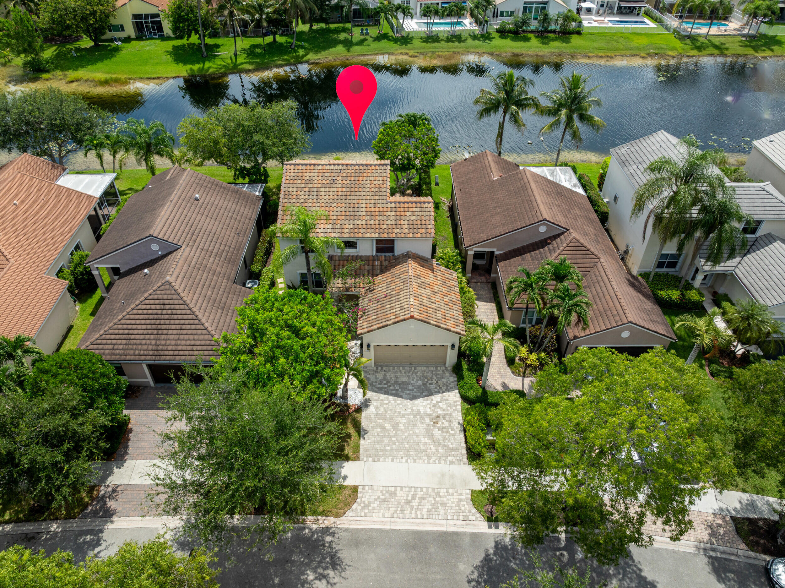 Welcome to this stunning waterfront residence nestled in The Lakes community. This home offers a thoughtfully designed living space with three bedrooms and 2.5 bathrooms to accommodate your needs. Elegantly appointed with wood-like porcelain floors, updated bathrooms and kitchen. Peace of mind with a roof replaced on 2023 and accordion shutters. The exquisite bucolic and private backyard has travertine floors and a relaxing lake view. Whether you're seeking a comfortable retreat or a practical investment, this home delivers both. In a hard-to-beat location very close to A+ schools and a strip plaza with supermarket, pharmacy, restaurants, shops and services. Will be gone soon!