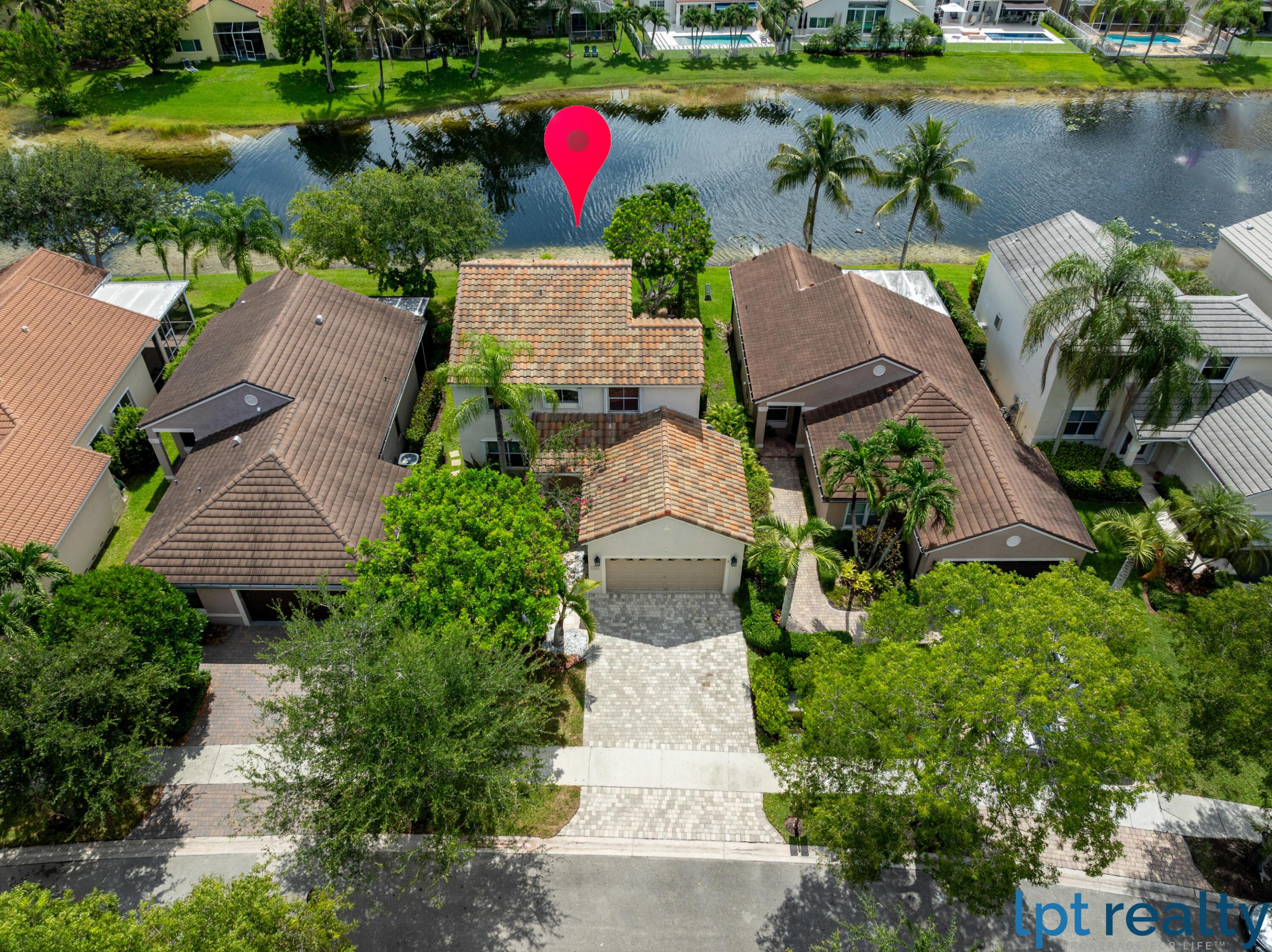 Welcome to this stunning waterfront residence nestled in The Lakes community. This home offers a thoughtfully designed living space with three bedrooms and 2.5 bathrooms to accommodate your needs. Elegantly appointed with wood-like porcelain floors, updated bathrooms and kitchen. Peace of mind with a roof replaced on 2023 and accordion shutters. The exquisite bucolic and private backyard has travertine floors and a relaxing lake view. Whether you're seeking a comfortable retreat or a practical investment, this home delivers both. In a hard-to-beat location very close to A+ schools and a strip plaza with supermarket, pharmacy, restaurants, shops and services. Will be gone soon!