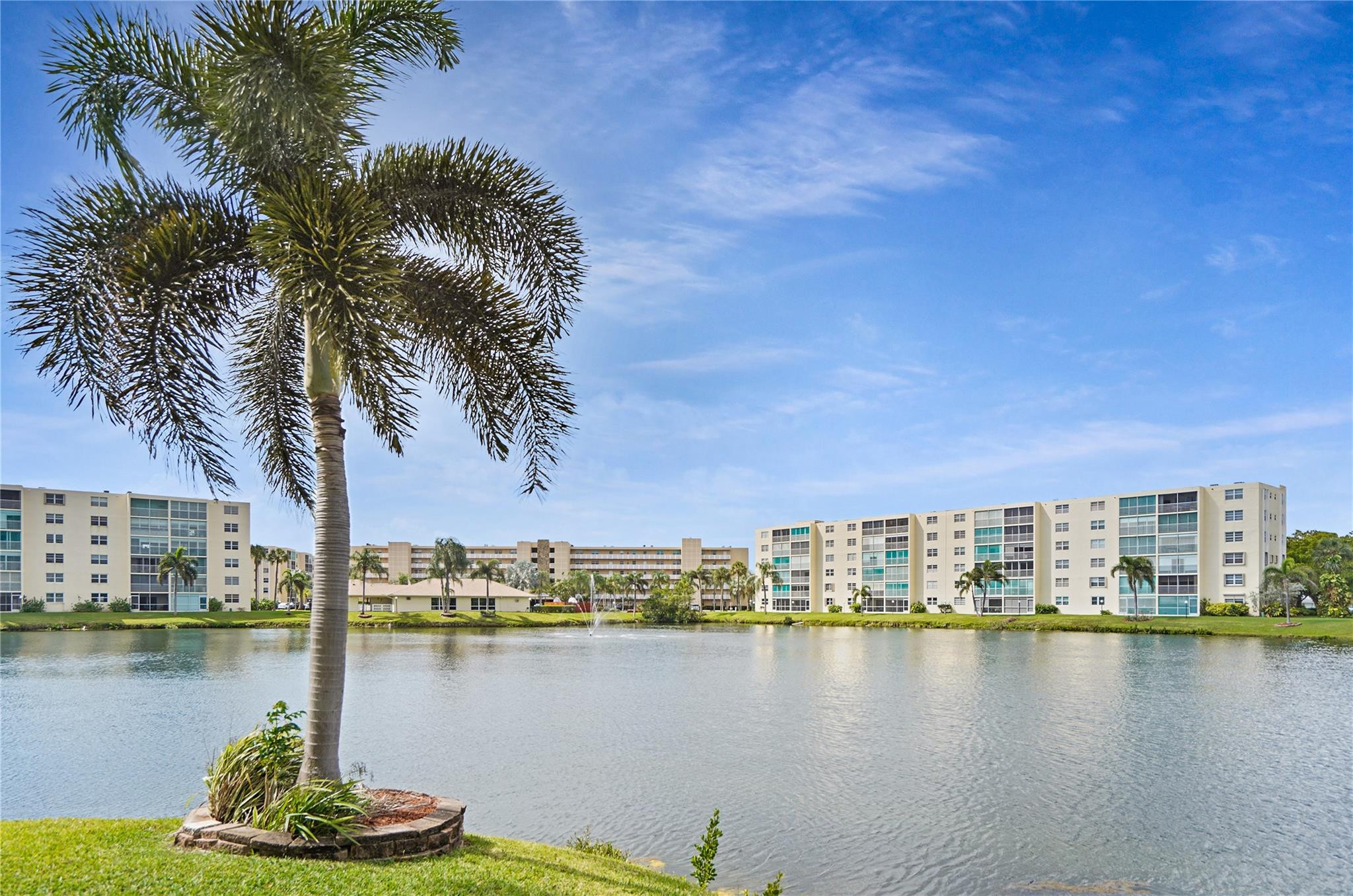Welcome to your serene lakeside retreat in the highly desirable 55+ active adult community of Meadowbrook Lakes! Located East of US-1, this spacious 3rd-floor condo features 2 bedrooms, 2 bathrooms, and 1,190 sq ft of bright, open living space. Enjoy beautiful water views from your private, screened-in balcony—the perfect spot for morning coffee. This well-maintained unit boasts complete impact glass for peace of mind, ceramic tile throughout, central A/C, and a walk-in closet. The financially strong association features fully funded reserves and fantastic amenities including a clubhouse, heated pool, and fitness center. Cable, water, and trash are included in the quarterly fee. Minutes to pristine beaches, shopping, dining, and FLL Airport. Sold As-Is.