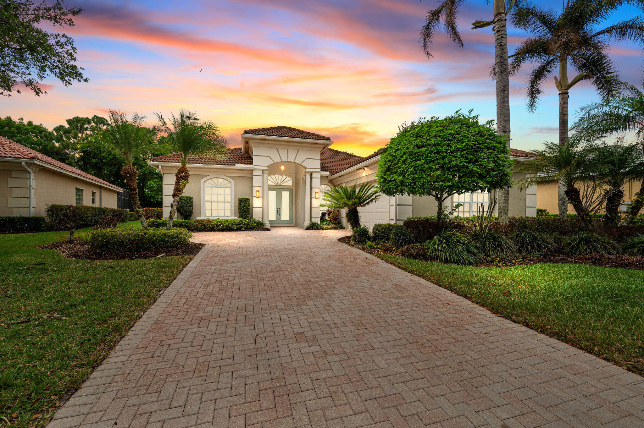 Positioned on the 3rd green of the Wanamaker Course and in walking distance to the Island Club, this is the perfect location for your PGA Village home. Step through the front door to a captivating view of your sparkling pool, framed by lush tropical foliage and the golf course beyond.  Recently updated, this immaculate, move-in-ready residence features the Arlington floor plan, which focuses the home's many windows around the pool and outdoor entertaining area.  Spanning over 3,000 sq ft, it offers 4 bedrooms, all with walk-in closets, plus 3.5 baths, providing ample space for family and guests. Close to I-95 and just 45 minutes from Palm Beach Airport, Port St. Lucie boasts world-class golf, postcard-perfect beaches, and abundant recreation, shopping, and dining.  See photos for more info